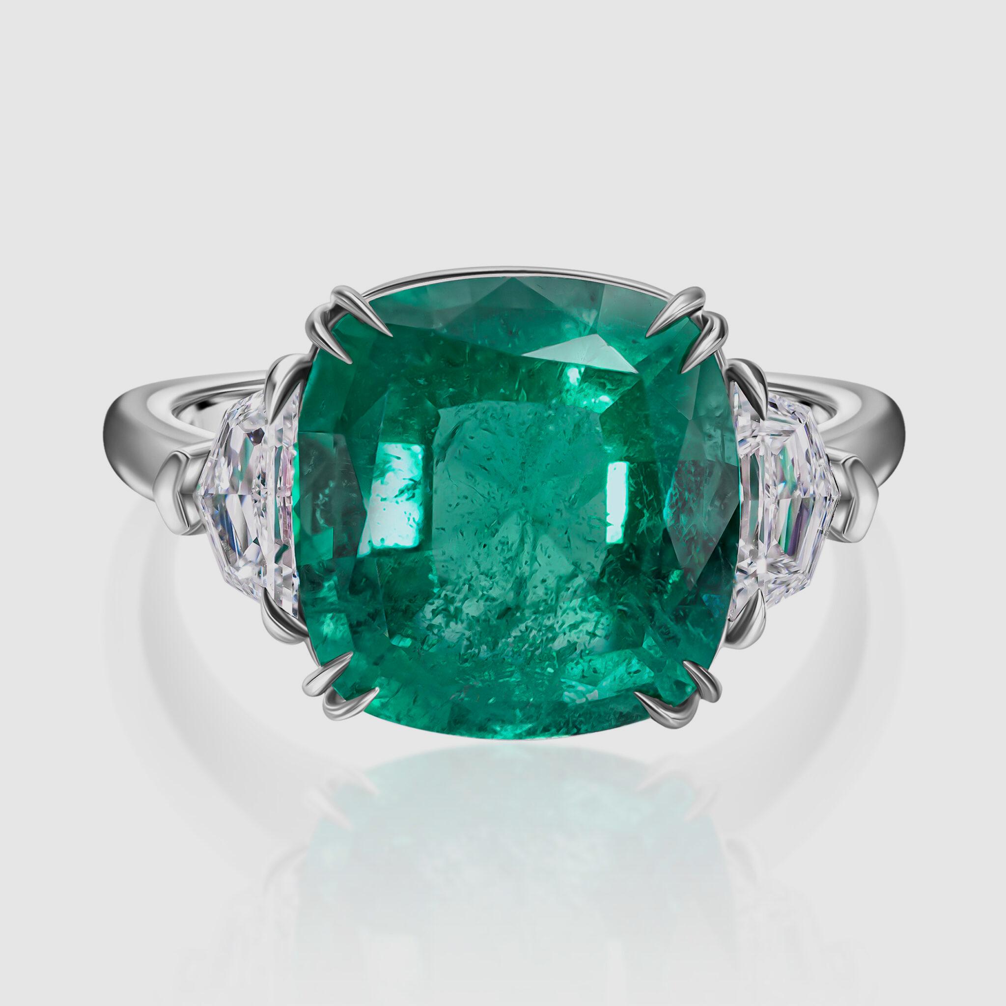 Experience unparalleled sophistication with our GRS-certified Cushion Cut Natural Emerald Ring, where timeless beauty meets modern allure. The ring features a stunning 6.01-carat Cushion Cut Emerald as its centerpiece, exuding unmatched grace.