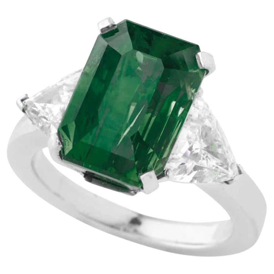 Certified 6.15 Carat Green Emerald Diamond Platinum Ring features a stunning emerald that exhibits a rich, vibrant green color, showcasing the beauty that makes emeralds highly sought after. The certification from GRS (GemResearch Swisslab) ensures