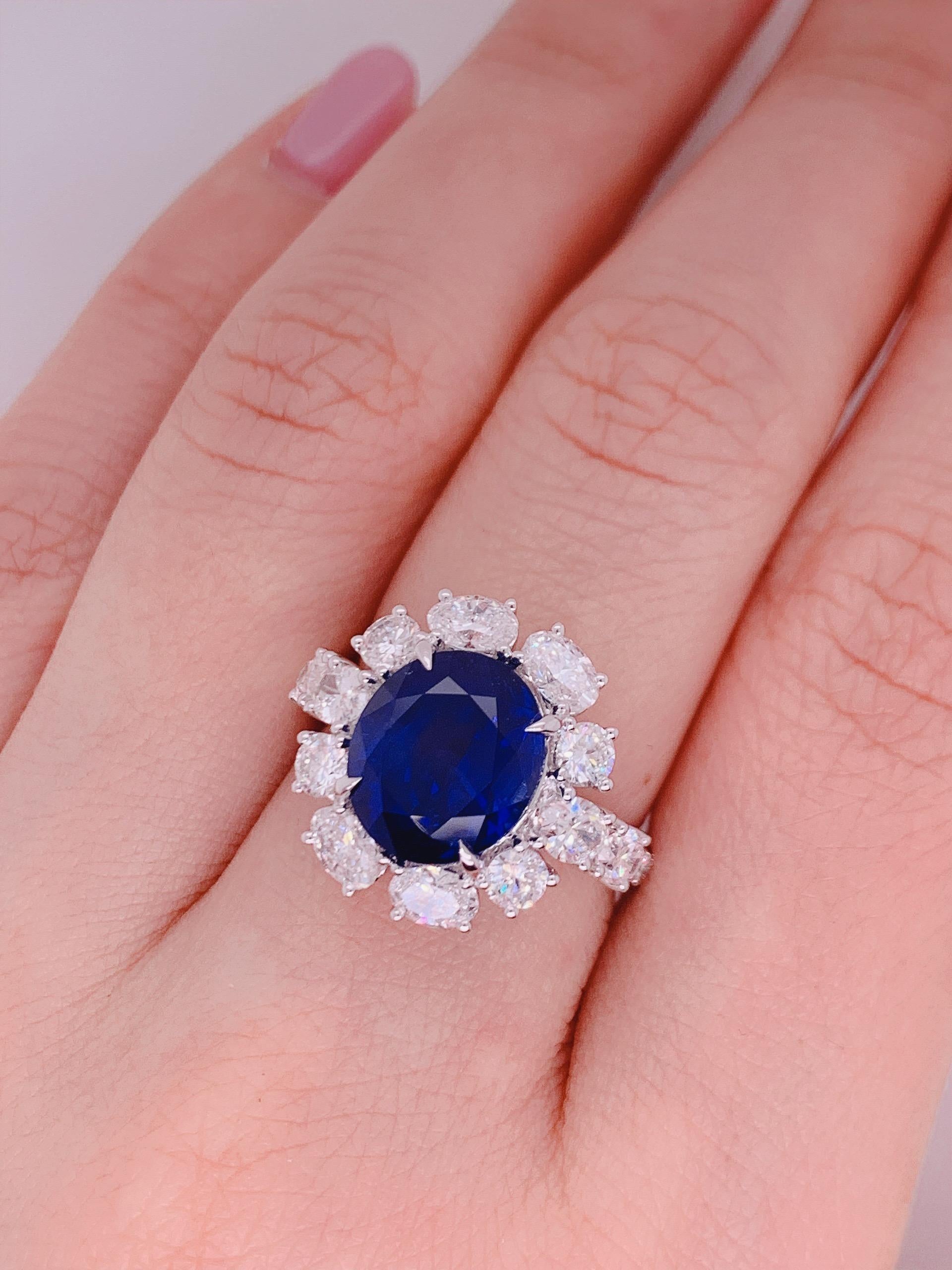 6.22 carat OVAL shape Ceylon Royal blue Sapphire with white diamond finished in white gold. 

With the classic design, oval white diamond around the center stone, simple and elegant .

Center stone certified by world wide known Swiss Laboratory -