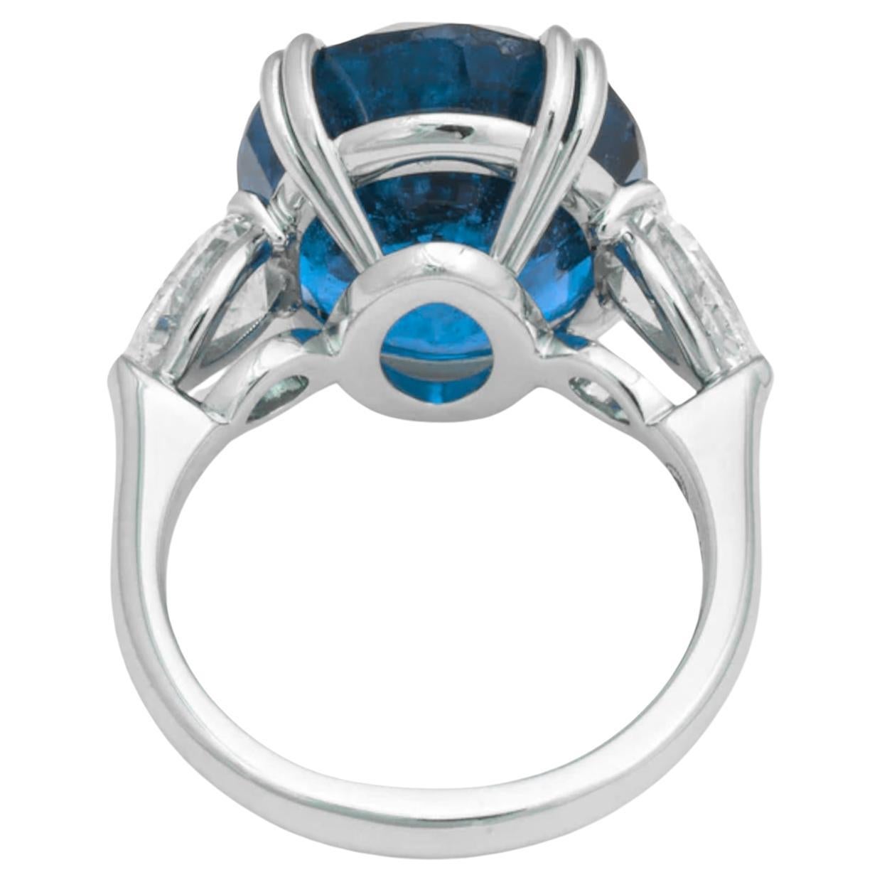 6.24-Carat Unheated and Untreated Oval Sapphire Ring with Pear-Cut Diamonds, Certified by GRS

Discover a masterpiece of natural beauty and timeless elegance with this exceptional ring. At its heart is a stunning 6.24-carat oval sapphire, unheated