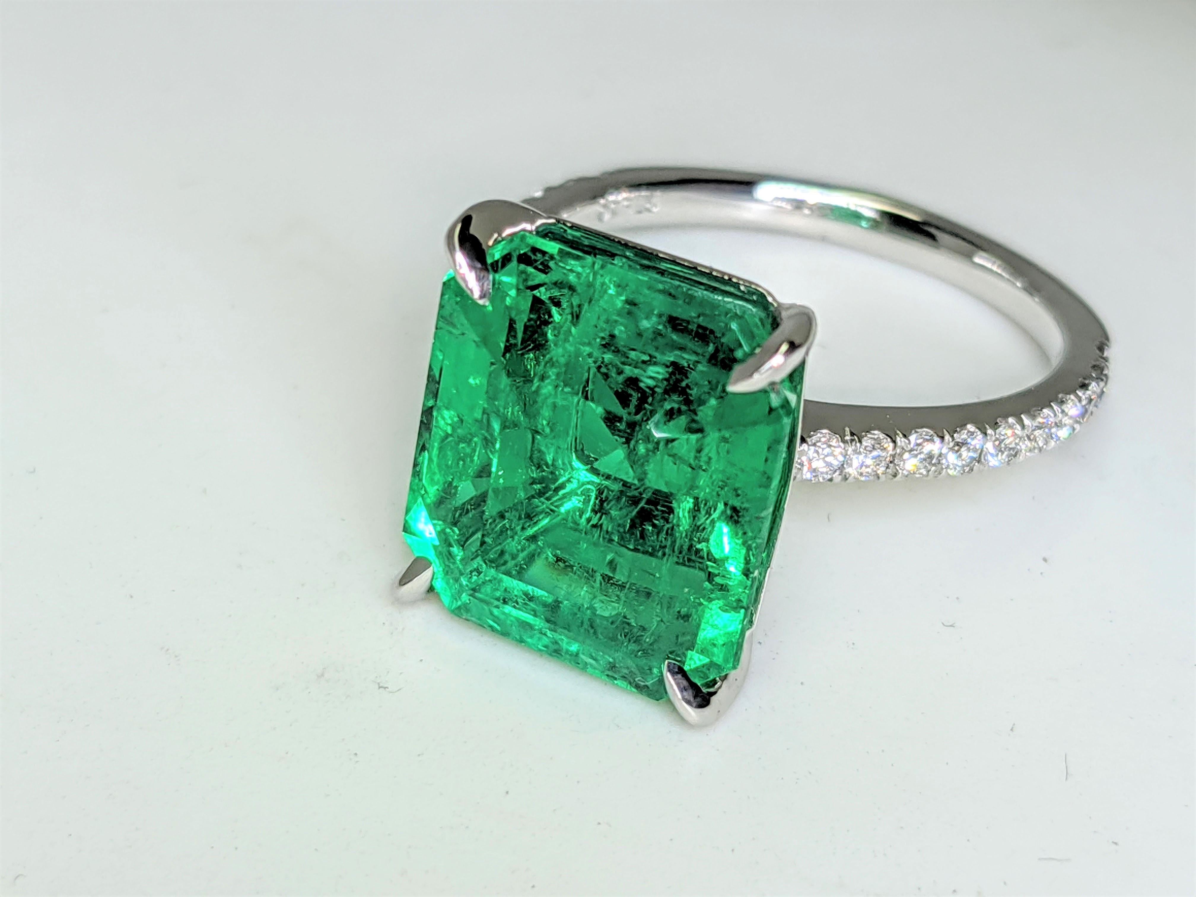 GRS Certified 6.31 carat Colombian emerald cut Emerald, very high quality color,  embellished by a pave' of bright diamonds of approximately total carat weight of 0.32 carat, set in a hand crafted Platinum 950 ring, manufactured with the best