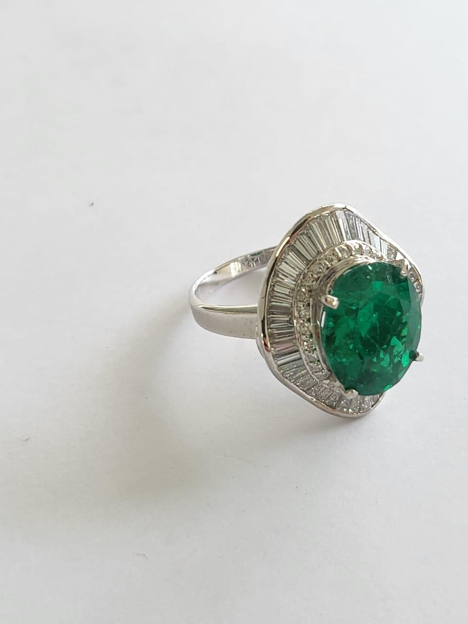 Oval Cut GRS Certified, 6.42 carats, Muzo, Colombian Vivid Green Emerald & Diamonds Ring For Sale