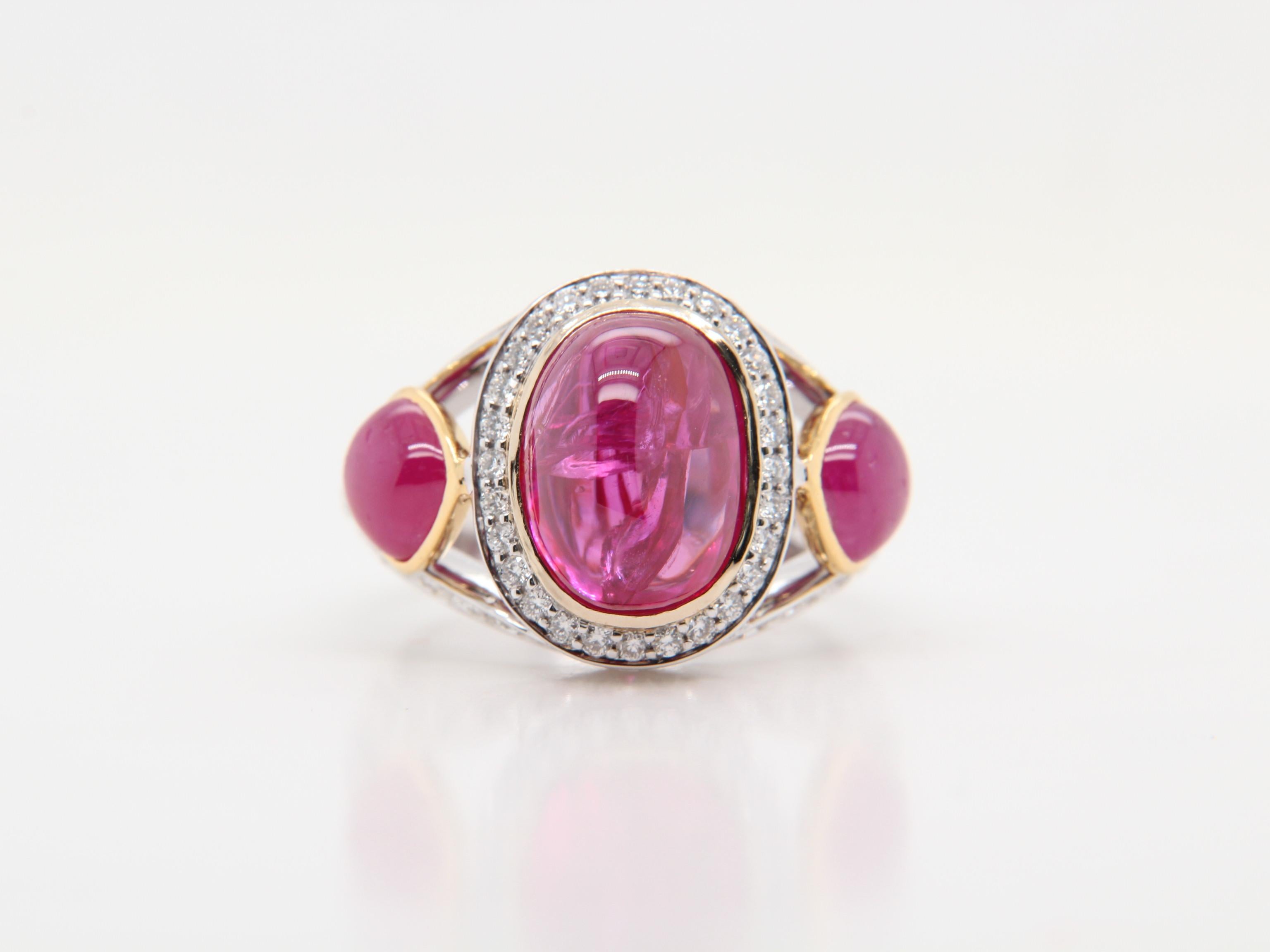 A beautifully crafted cabochon ruby and diamond ring made with 18 karat gold. The total ruby weight is 6.46 carat and is certified by Gem Research Swisslab (GRS) as natural, no heat, and Pinkish-Red from ‘Mogok’. The total diamond weight is 1.34