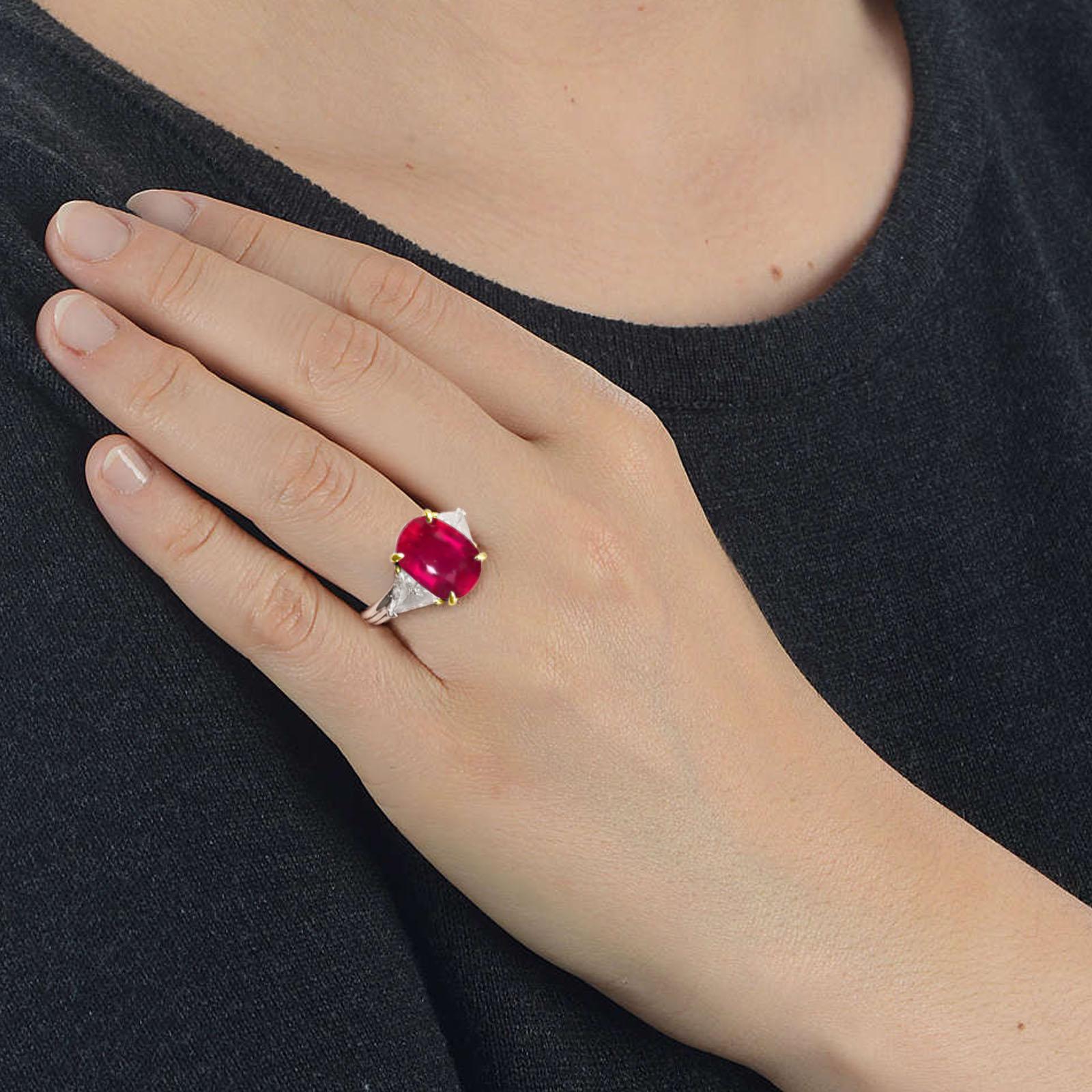 A STUNNING red ruby diamond ring!

GRS Certified 6.72 Carat Natural Untreated Unheated Red Ruby Diamond Ring

.60 carats of white side diamonds.

Custom platinum and 18k yellow gold mounting.

Size 6, this ring can easily be resized.