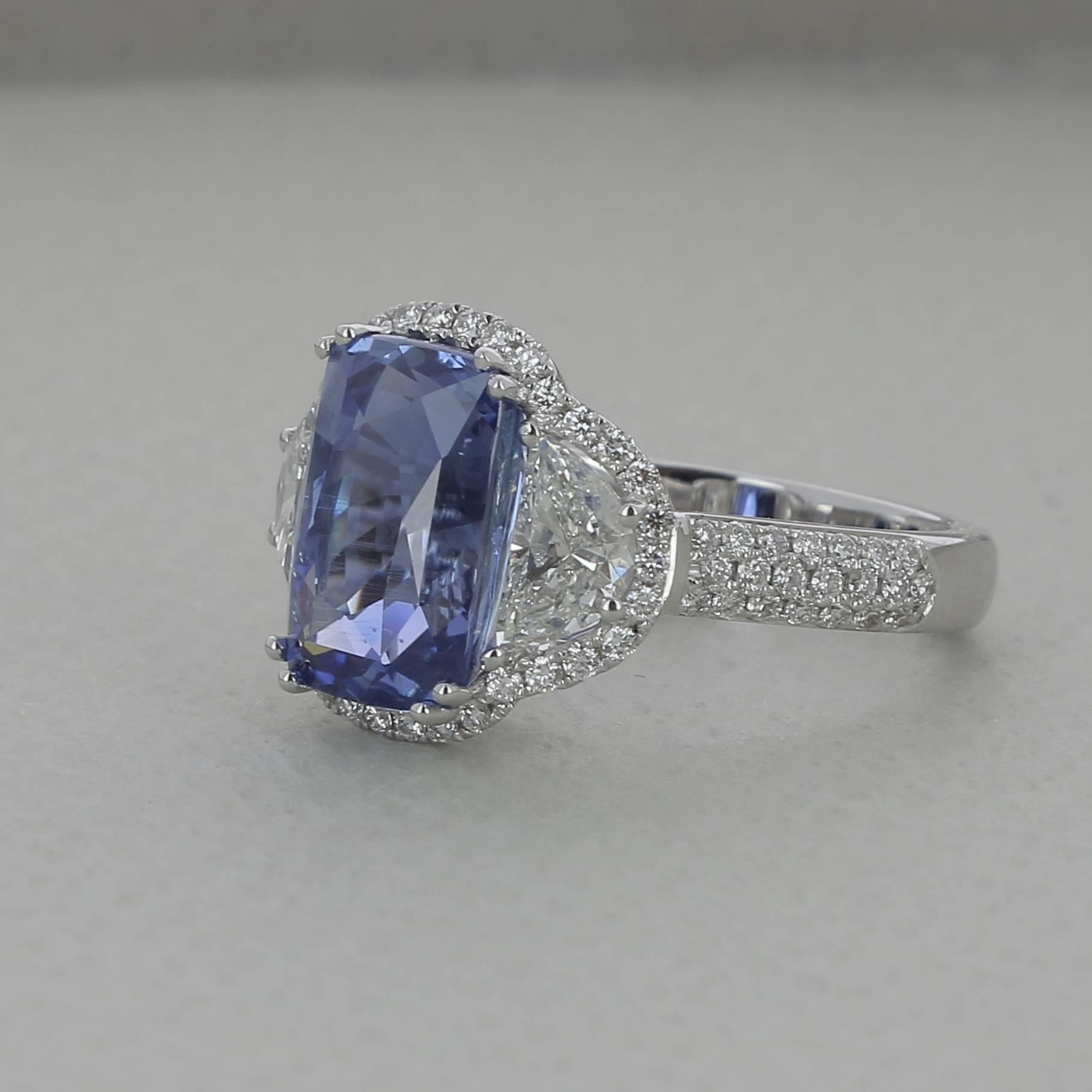 An amazing Ceylon Sapphire Ring, flanked on each side by a half moon Diamond.
The total weight of the Ceylon  Sapphire ( or Sri Lanka Sapphire ) is 6.77 Carat.
The Half Moon Diamond weight is 1.07 Carat ( 2 half moon Diamonds ).
All this beautiful