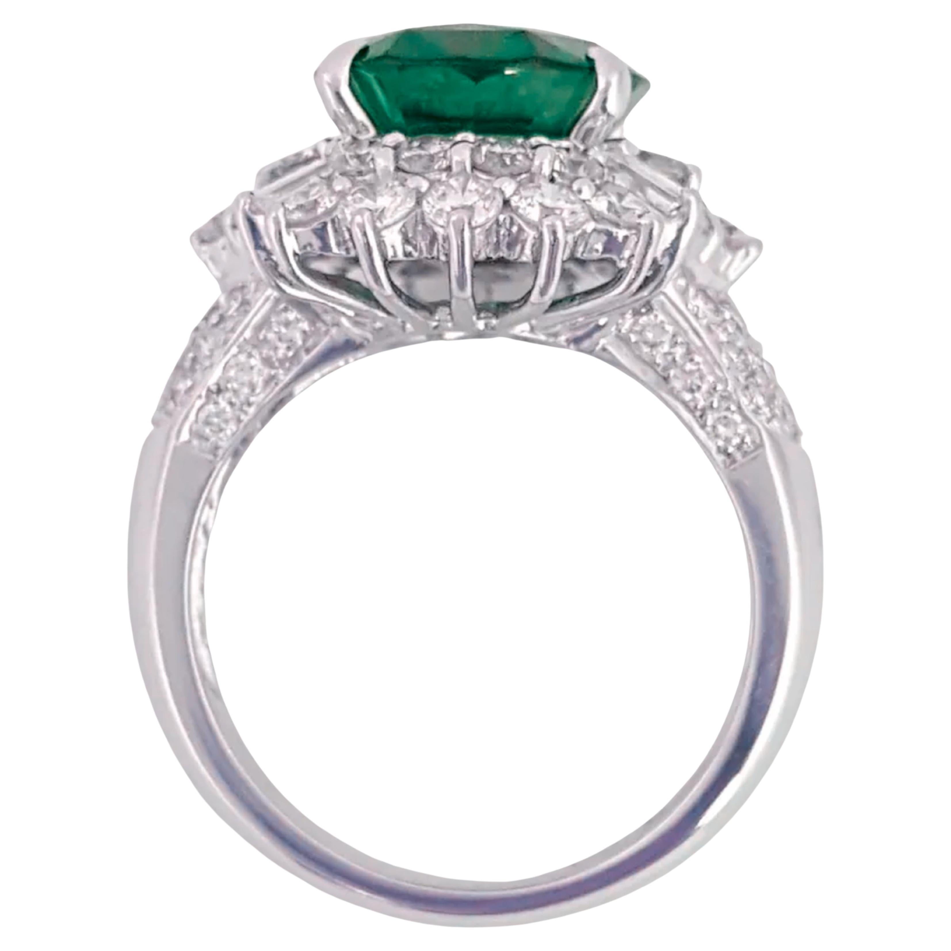 a truly exceptional investment piece: a stunning 7.30-carat, minor-oil emerald ring of the highest quality. This magnificent emerald, prized for its natural beauty and purity, is elegantly set in a luxurious design adorned with 1.50 carats of