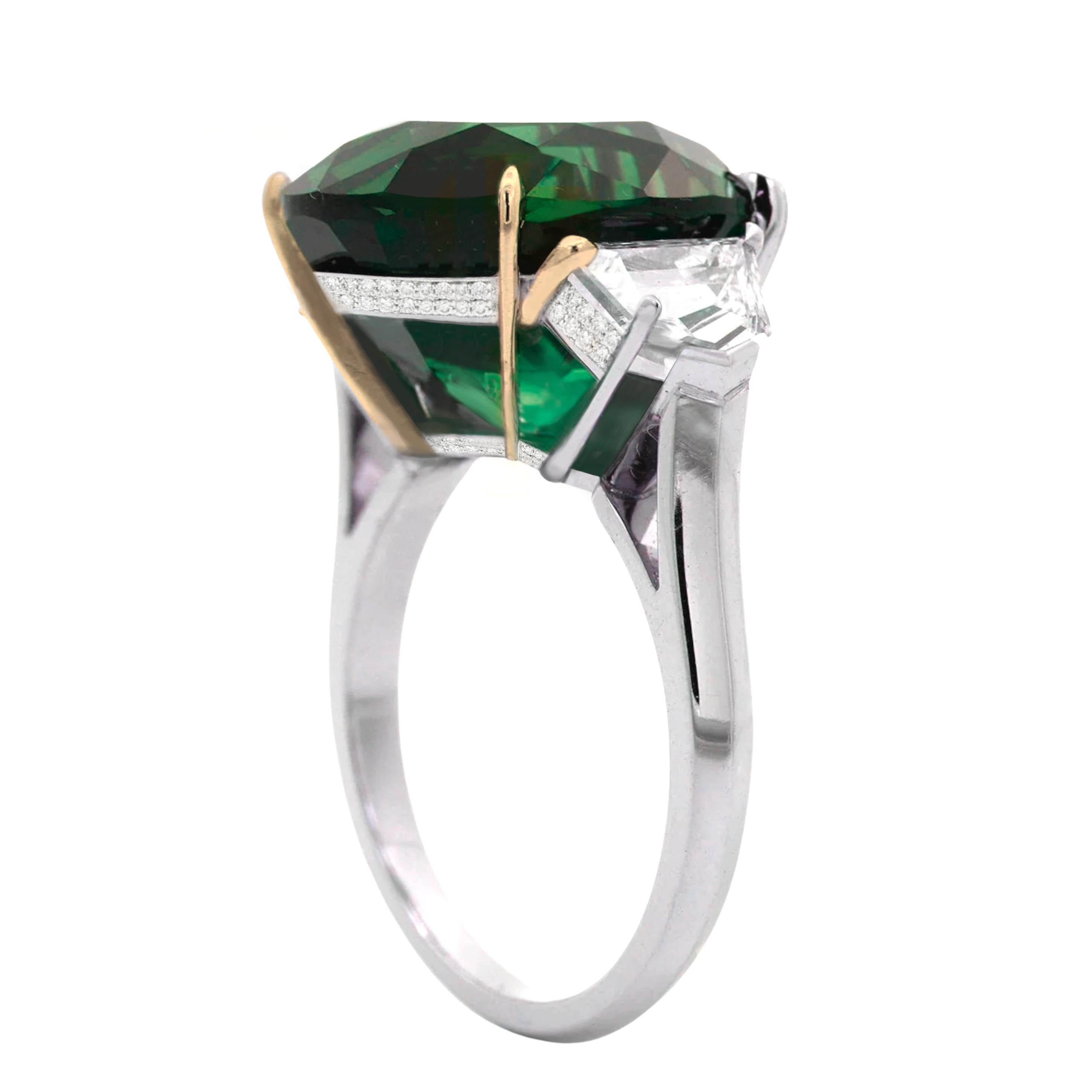 An exquisite 7.30 oval green vivid green emerald certified by GRS 
zambian origin

side diamonds are half moons and weight 1 carat e color vvs clarity 

set in solid platinum