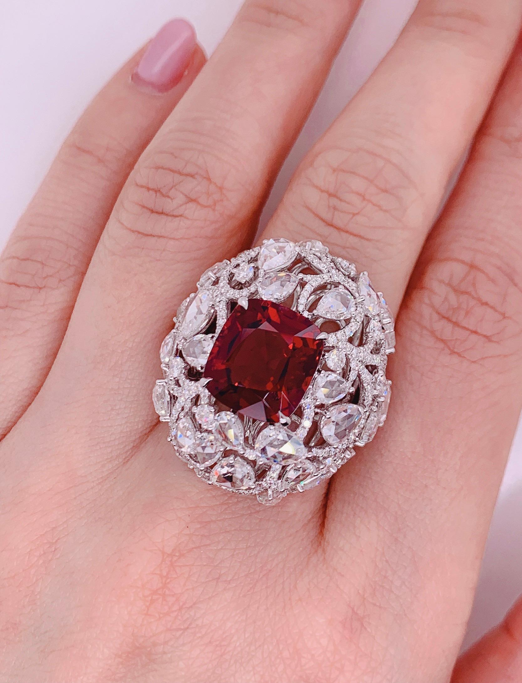 This ring present a 7.5 carat UNHEATED vivid Orangy- RED Spinel from Burma set with Rose cut white diamond in pear and round,  finished in white gold. 

Rose cut diamond are back into the design trend. It gives a feeling of vintage but at the same