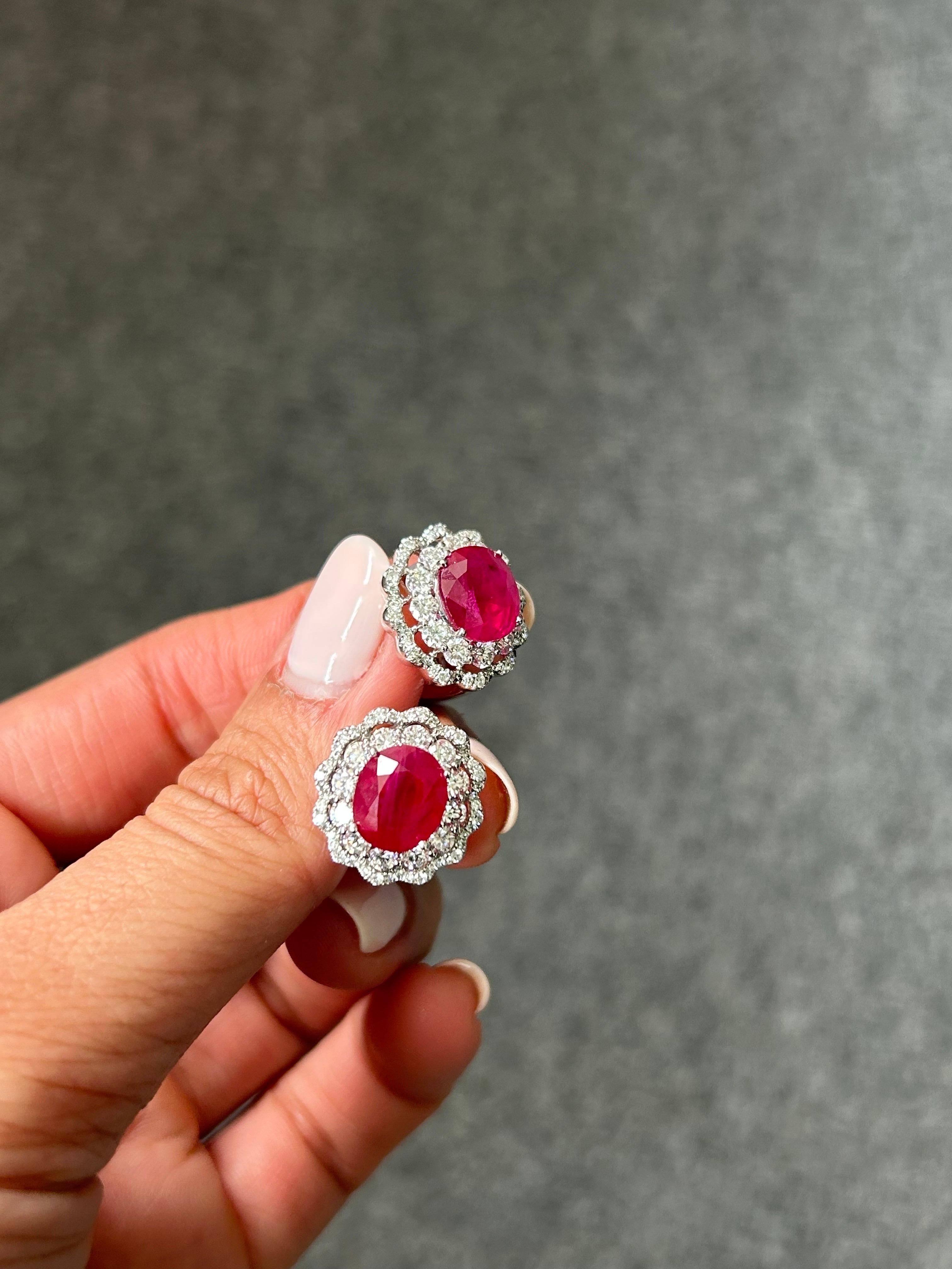 A stunning pair of GRS certified 7.5 carats oval shaped Burma Ruby studs, with 2.05 carat VS quality, G/H color Diamonds. The earrings come with an omega backing. 