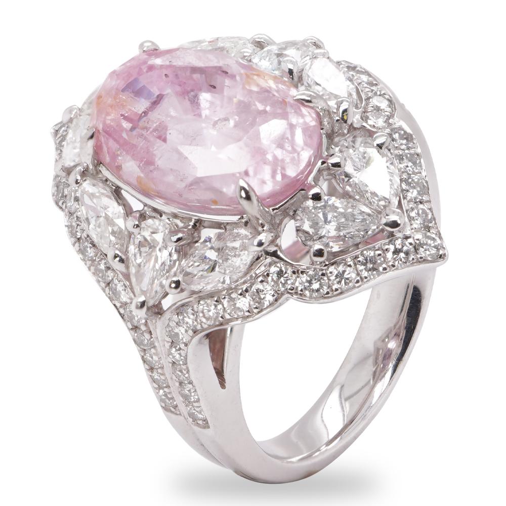 A GRS Certified Padparadscha Sapphire No heat from Sri Lanka is set along with 1.80 carat of white diamond in this Platinum PT 900 mounted Solitaire Ring.
Padparadscha sapphires have an exquisite color combination unlike any other colored gemstone.
