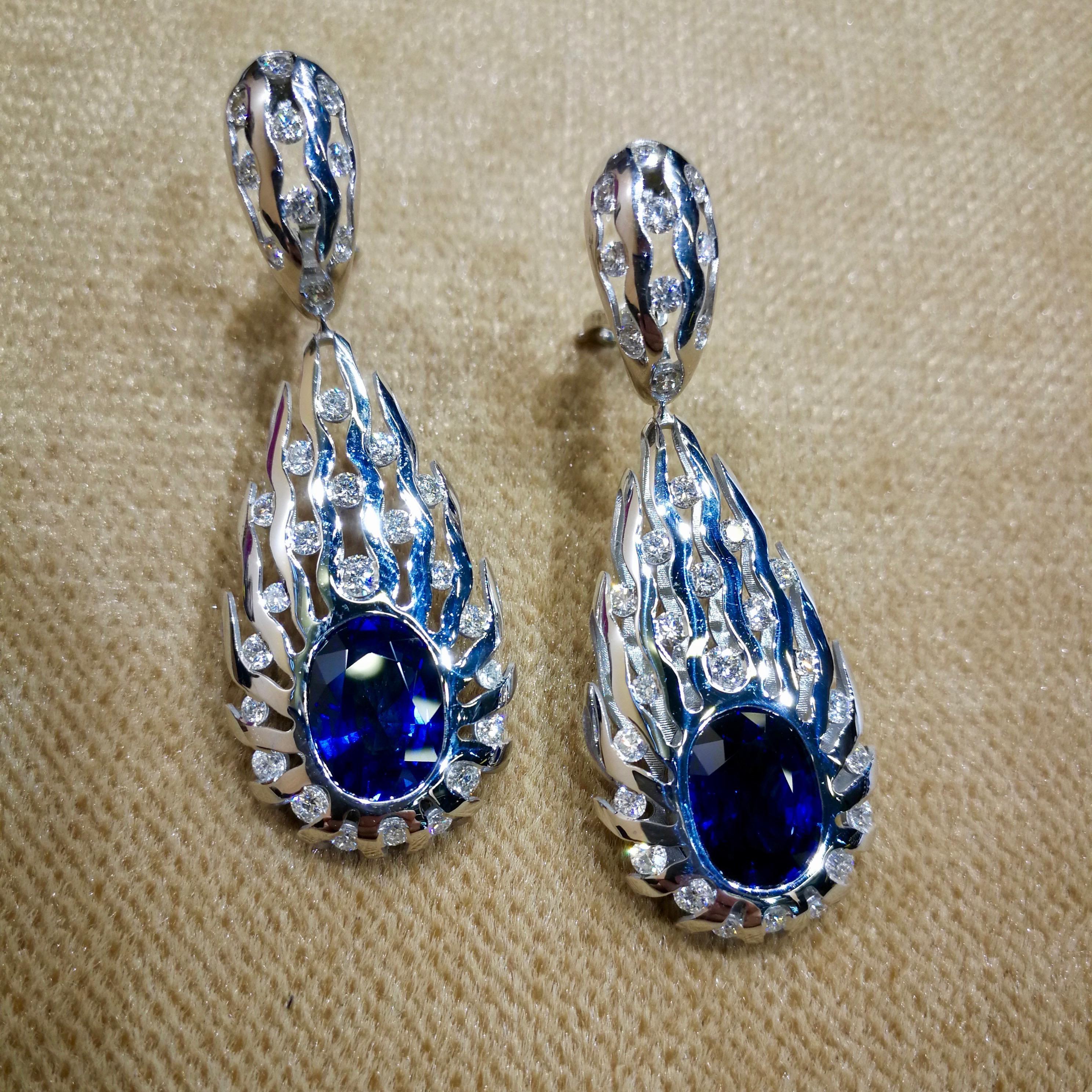 GRS Certified 8.03 Carat Royal Blue Sapphire Diamonds 18 Karat White Gold Earrings
These exquisite Earrings showcase two oval-cut Royal Blue Sapphires of over 8 Carats. Despite the fact that these two Royal Blue Sapphires are self-sufficient, paired