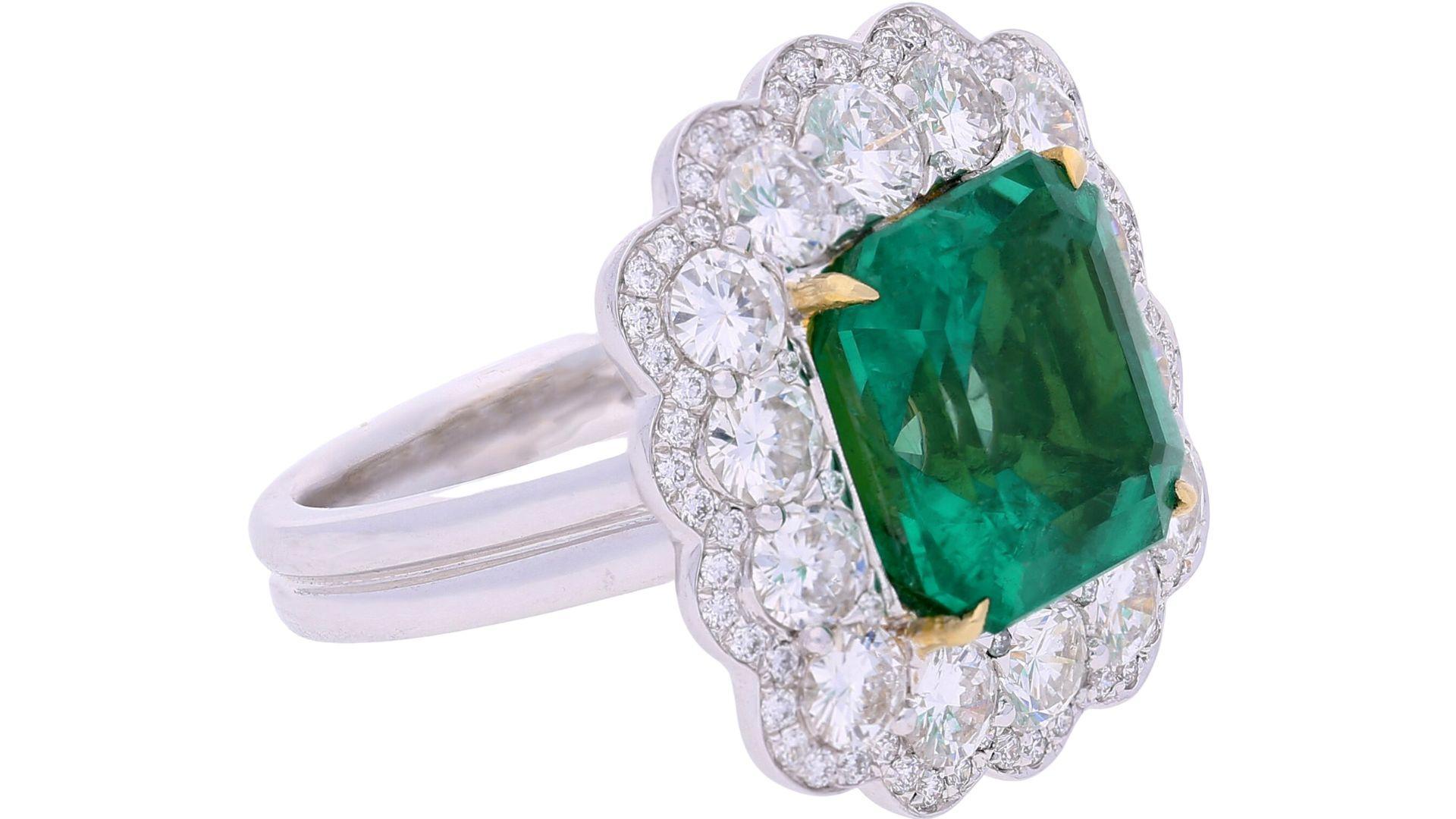 GRS Certified 8.04 carat octagonal emerald cut minor-moderate oil Colombian natural emerald & diamond halo ring. 

Details: 
✔ Item Type: Ring 
✔ Metal: 18k Yellow & White Gold 
)
✔ Weight: 10.89 grams
✔ Setting: Prong in yellow gold, diamonds held