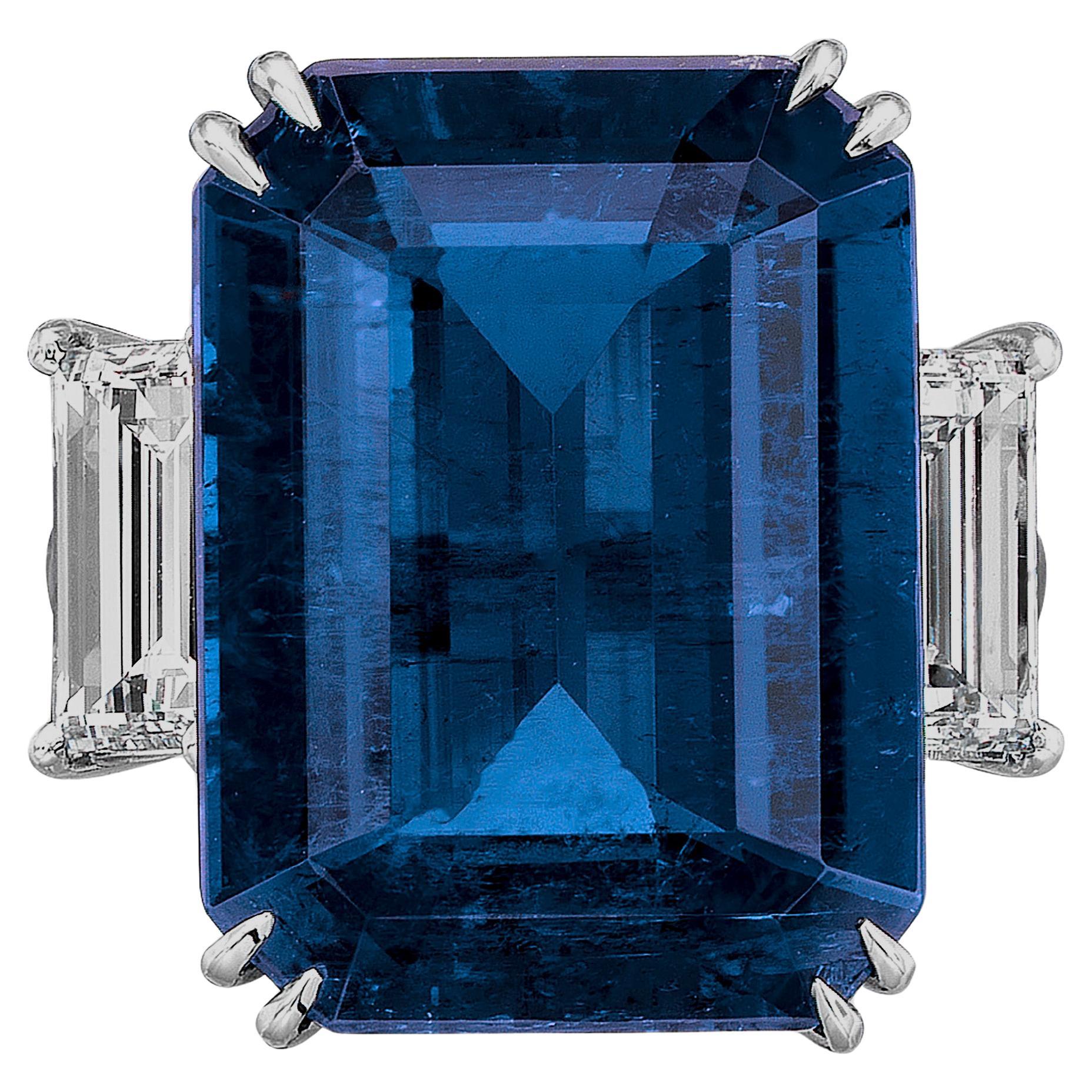 An exquisite ring composed by a 8.28 carat blue sapphire emerald cut ring with trapezoid side diamonds
The setting is made in solid 18 carats white gold
Flawless clarity

   