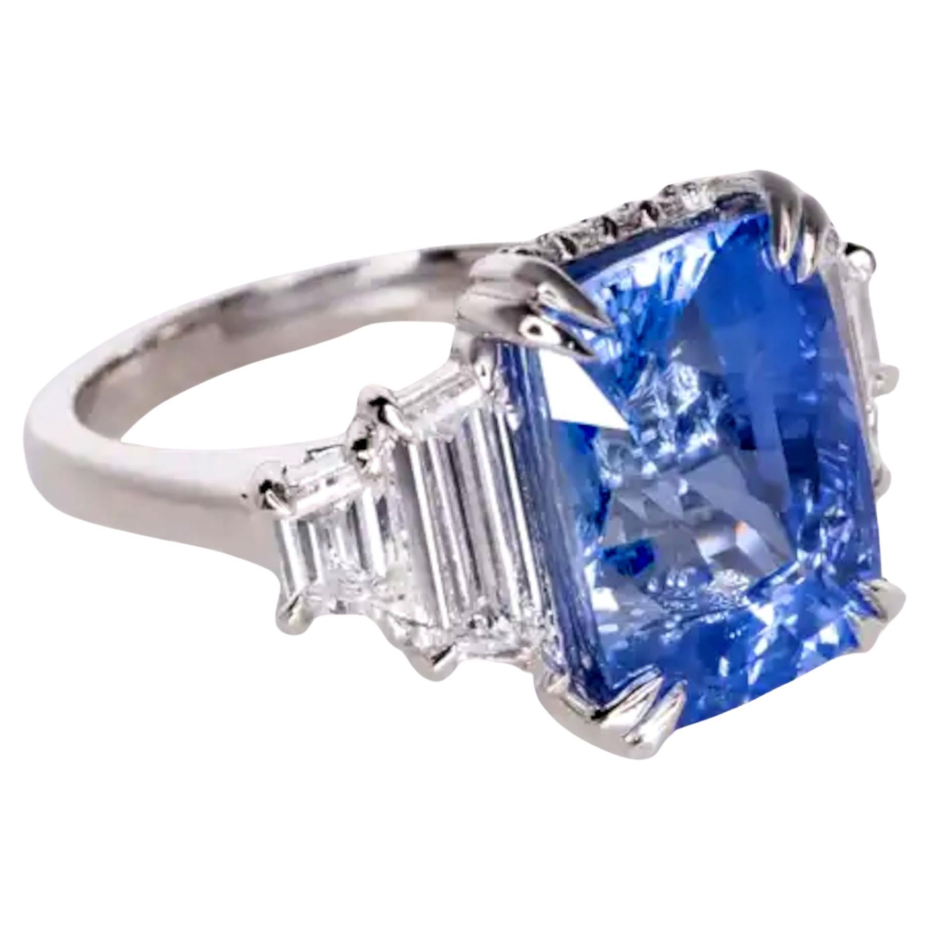 Exquisite 9.60 Carat Natural Sapphire and Diamond Platinum Ring

This stunning ring features a remarkable 9.60-carat natural sapphire of Sri Lankan origin, certified by GRS (Gemresearch Swisslab). The sapphire displays a vibrant blue color and is