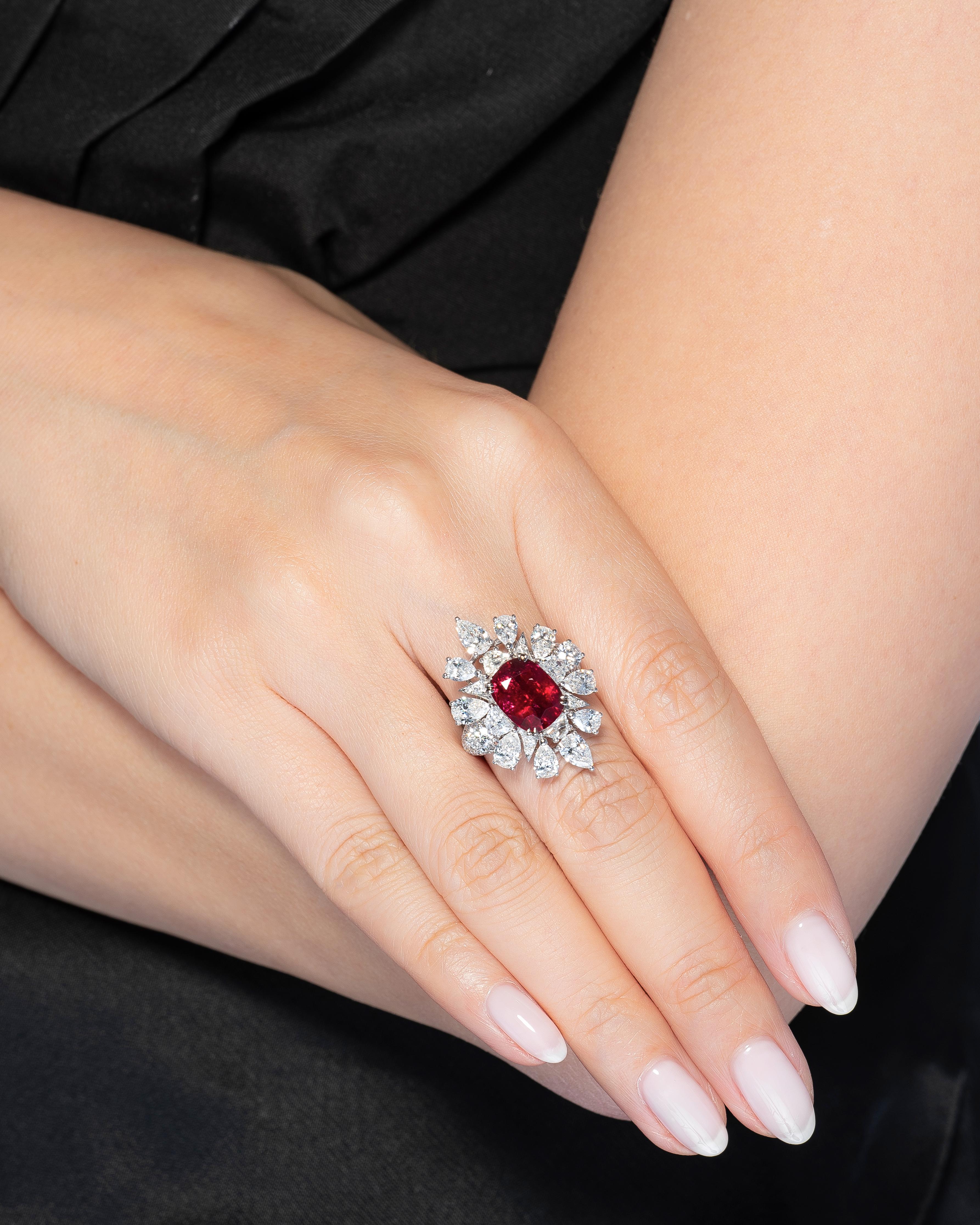 Vihari Jewels presents an enchanting 4.19 carat No-Heat Burmese Pigeon's Blood Ruby in an oval cut shape, surrounded by diamonds and set in Platinum. GRS certifies (Report 2018-048649) that this ruby is of natural variety, hailing from Burma and