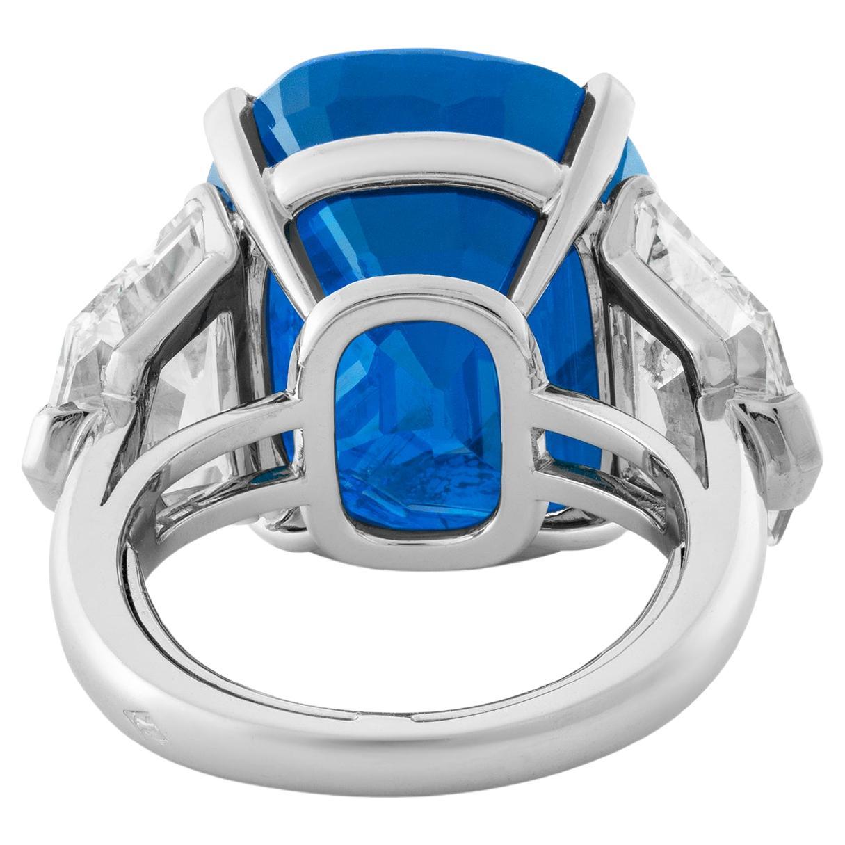 A SUPERB SAPHIRE AND DIAMOND RING, BY Cecile Blake
Cushion-shaped sapphire of 9.89 carats, oval-cut diamonds that sum 2 carats set in solid platinum
f color vvs1 clarity diamonds

GRS report Burma (Myanmar), no indications of heating