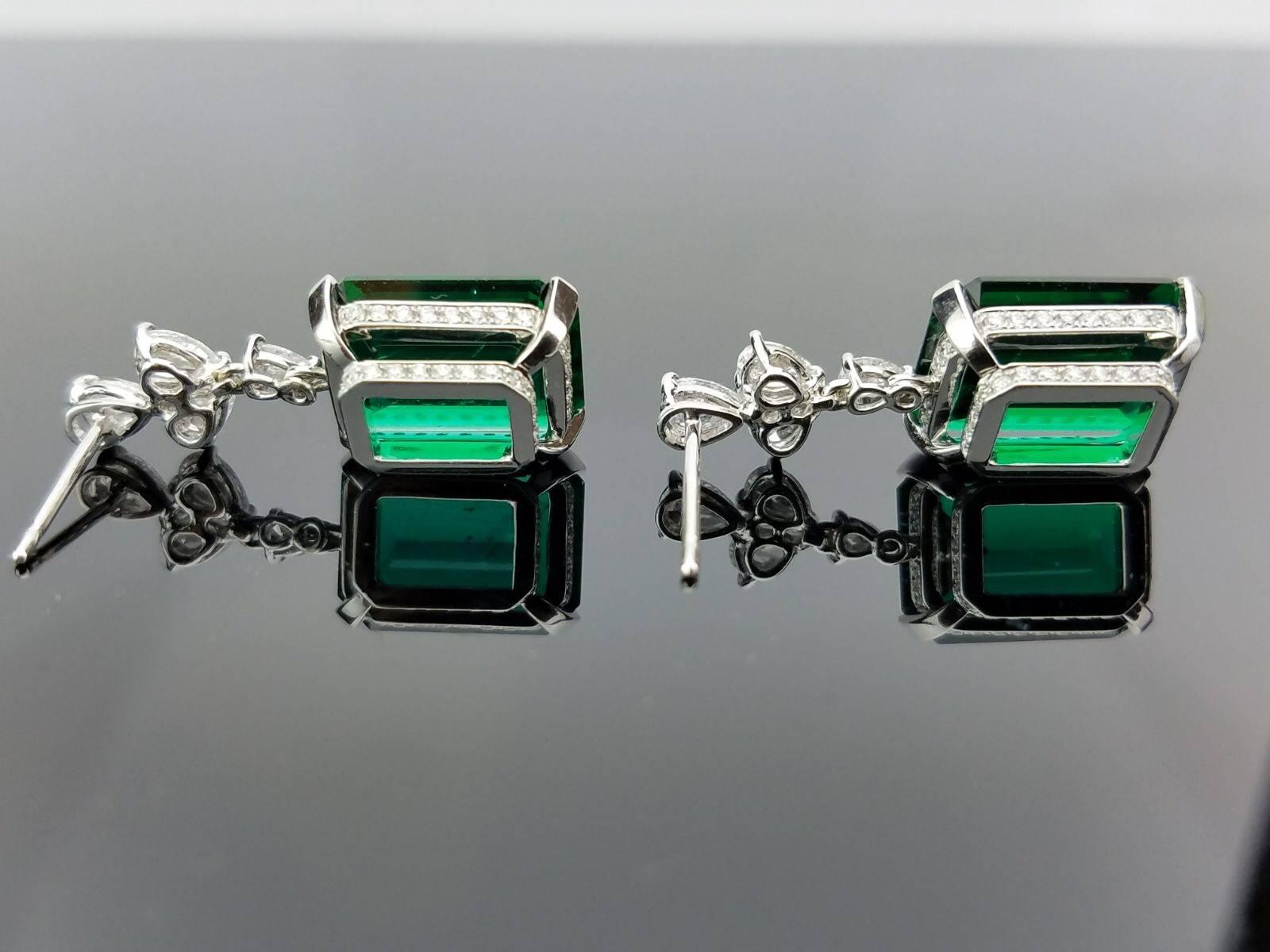 A magnificent pair of fine Emerald earrings (5.98ct, 5.81ct) set in 18K white gold, with very few inclusions in one piece and the other having nearly no inclusions. To find a pair of Emeralds of this size, colour and clarity is very rare. The pair