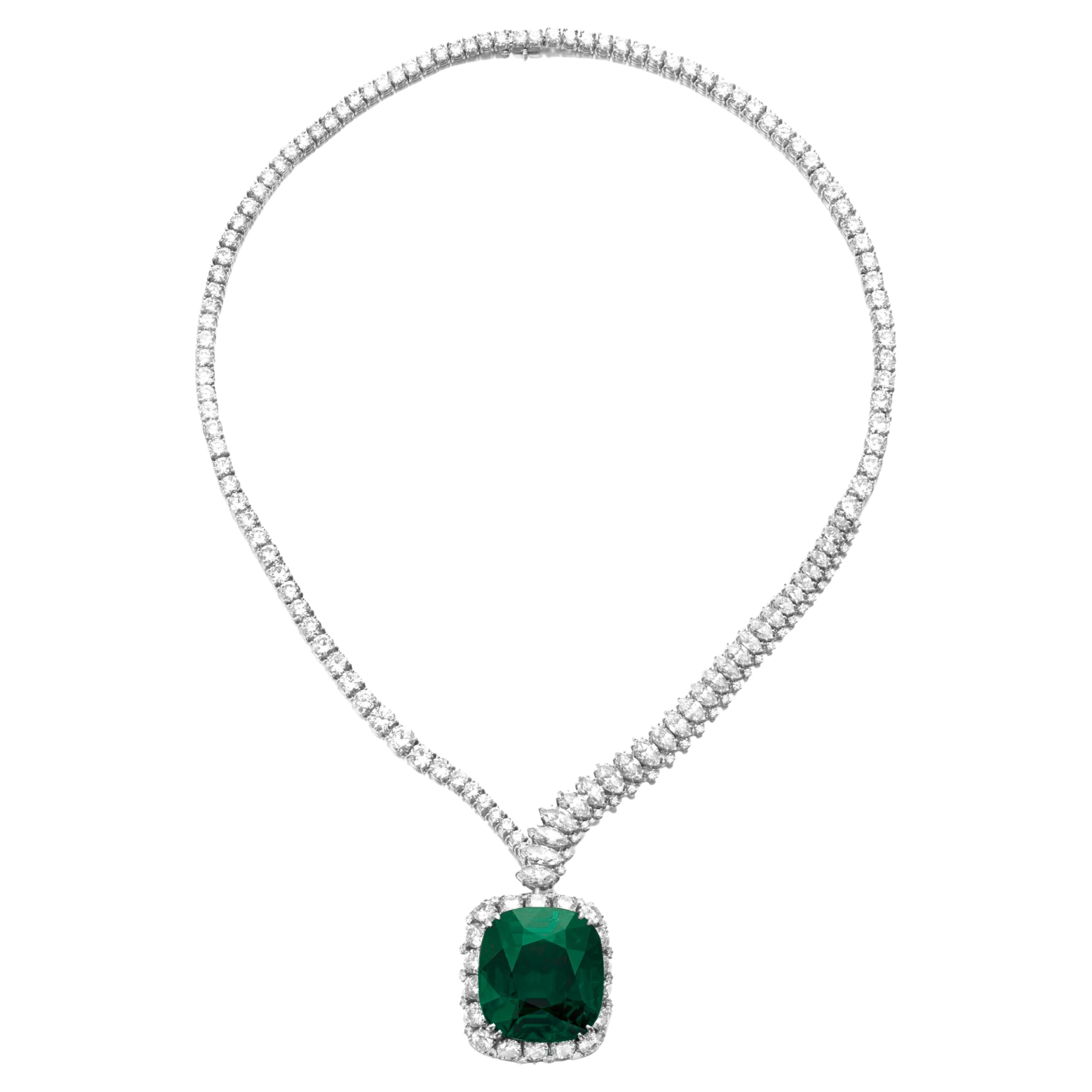 The necklace decorated with marquise-shaped and brilliant-cut diamonds, supporting a detachable pendant set with a cushion-shaped emerald weighing 19 carats within a brilliant-cut diamond frame

Accompanied by AGL report each stating that the