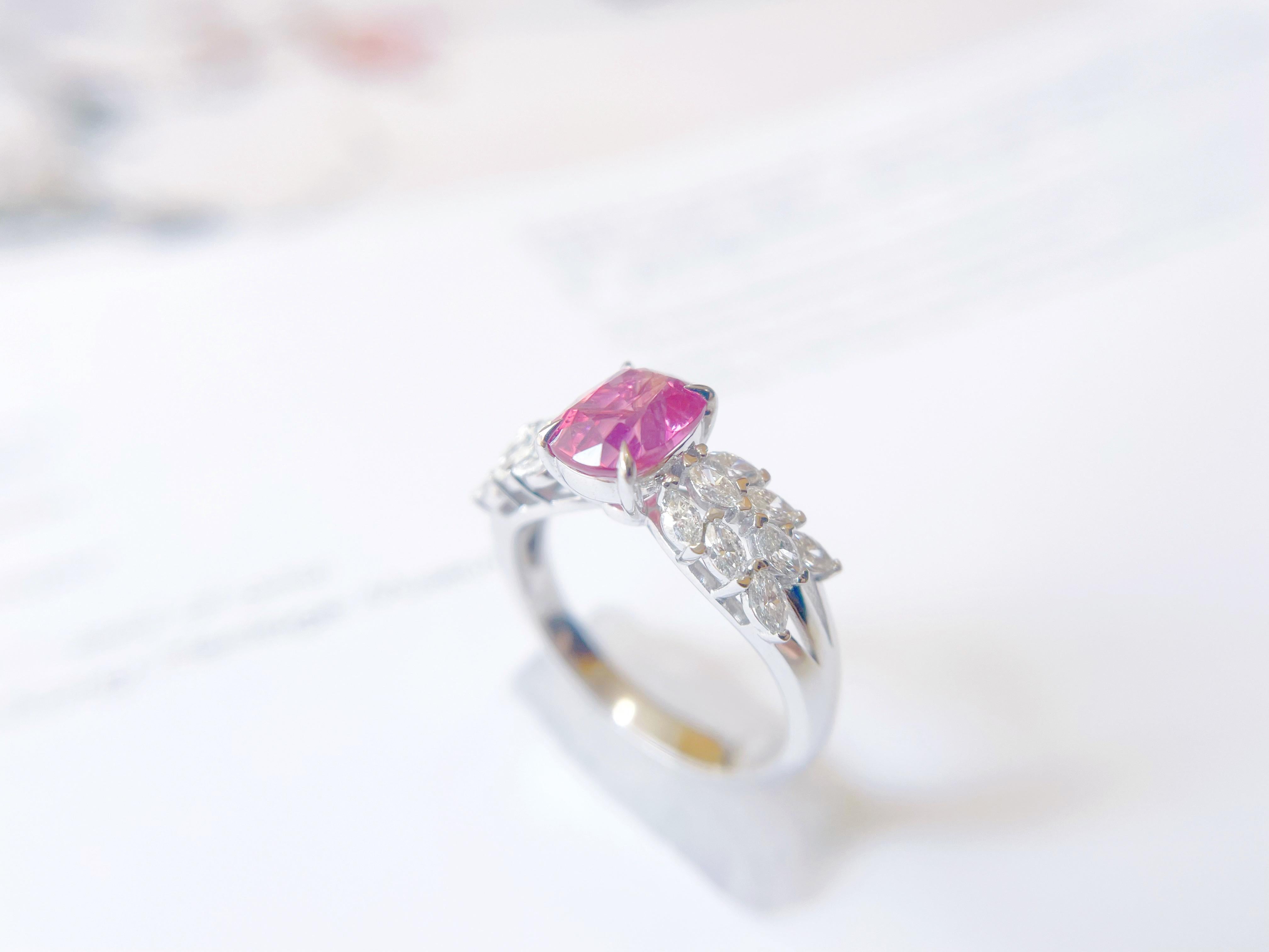 Introducing our exceptional Mahenge spinel, a rare and unique gemstone with a silky body reddish color and orange fire, now set in a custom-designed diamond ring. This natural Tanzania Mahenge is a true marvel of nature, boasting a captivating hue