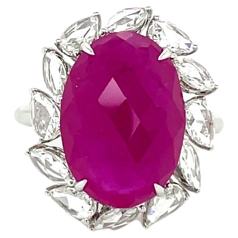 Nestled at its core is a breathtaking Ruby Oval Faceted gemstone, weighing an impressive 10.74 carats and with a certification from GRS attesting to its exceptional quality.

Encircling this radiant ruby are six exquisite Marquise-cut diamonds,