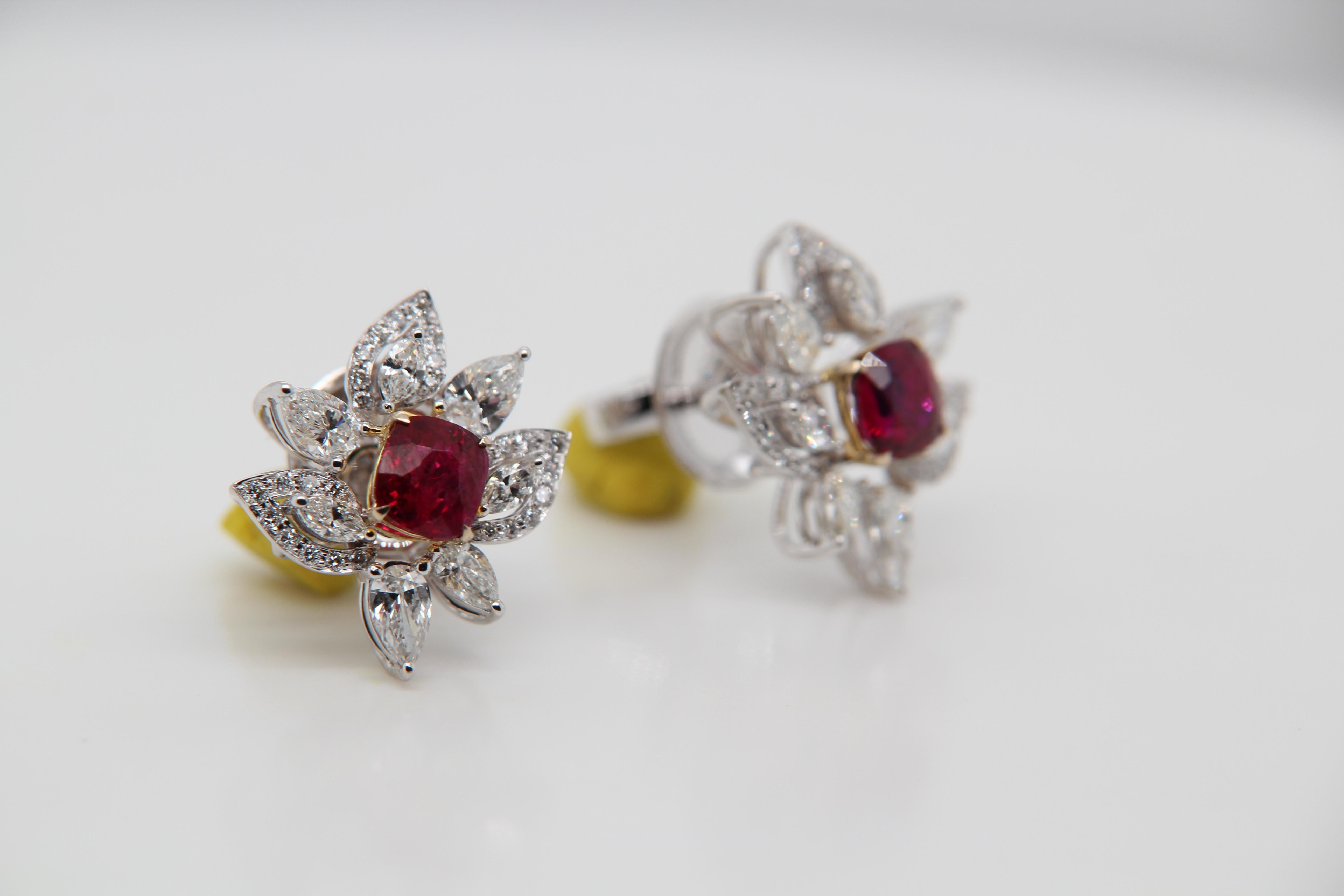 A new 2.23 carat Burmese ruby earring mounted with diamonds in 18 Karat gold. The ruby weighs 1.13 and 1.10 carats and are certified by Gem Research Swisslab (GRS) as natural, no heat, and 'Vivid Red Pigeon's Blood'. The total diamond weight is 3.07