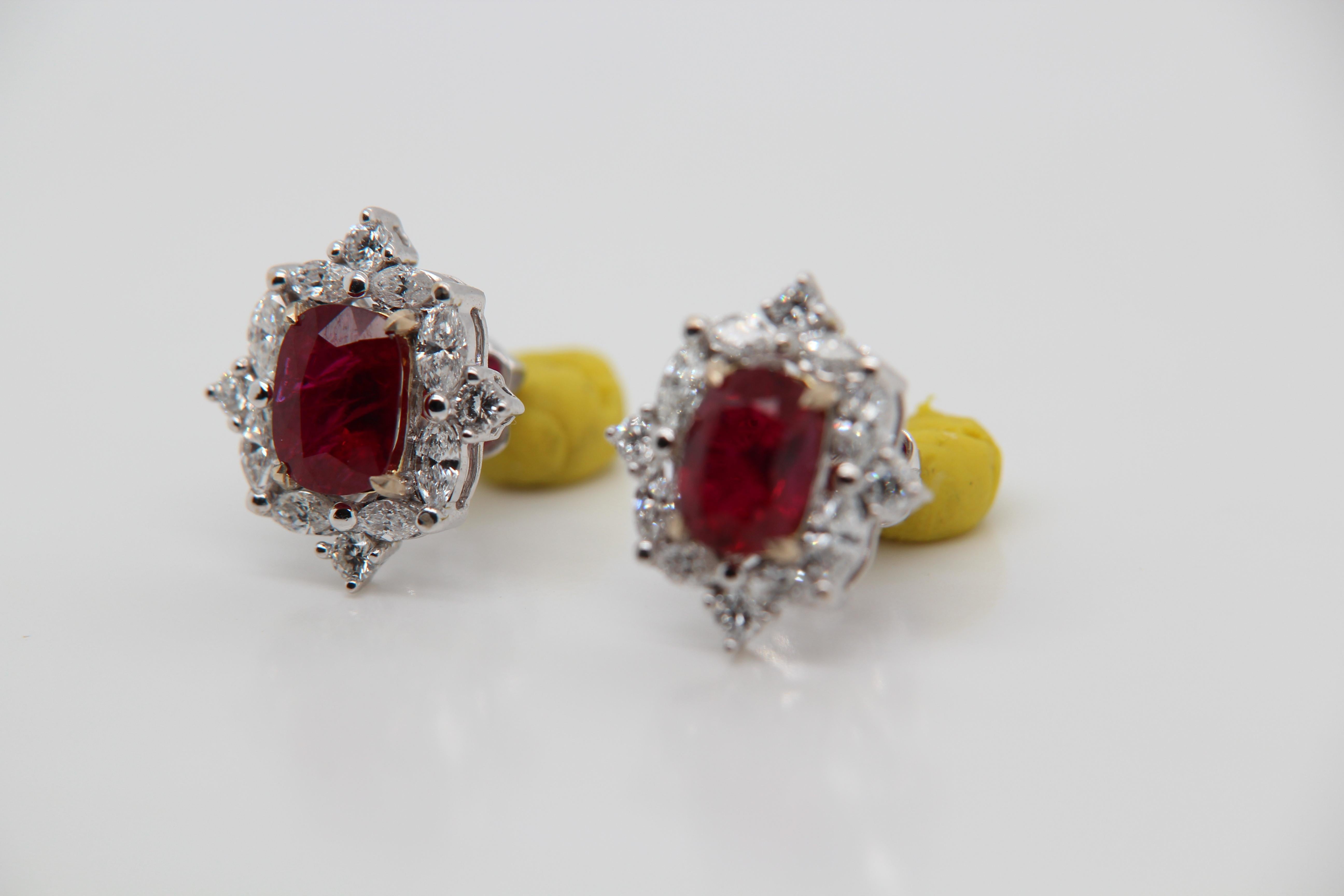 A new 2.74 carat Burmese ruby earring mounted with diamonds in 18 Karat gold. The ruby weighs 1.33 and 1.41 carats and are certified by Gem Research Swisslab (GRS) as natural, no heat, and 'Vivid Red Pigeon's Blood'. The total diamond weight is 1.14