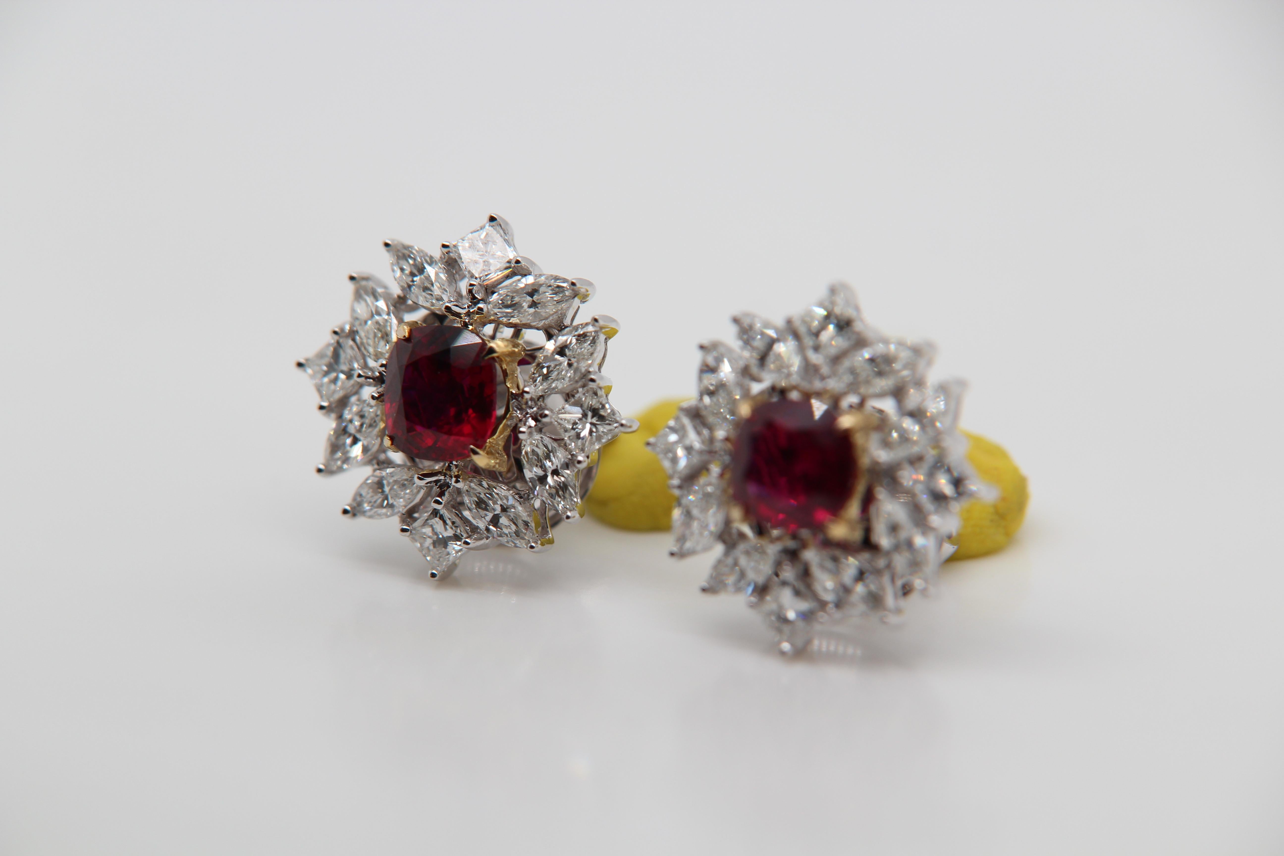 A new 2.15 carat Burmese ruby earring mounted with diamonds in 18 Karat gold. The ruby weighs 1.05 and 1.10 carats and are certified by Gem Research Swisslab (GRS) as natural and no heat. One piece is 'Vivid Red' and the other is 'Vivid Red Pigeon's