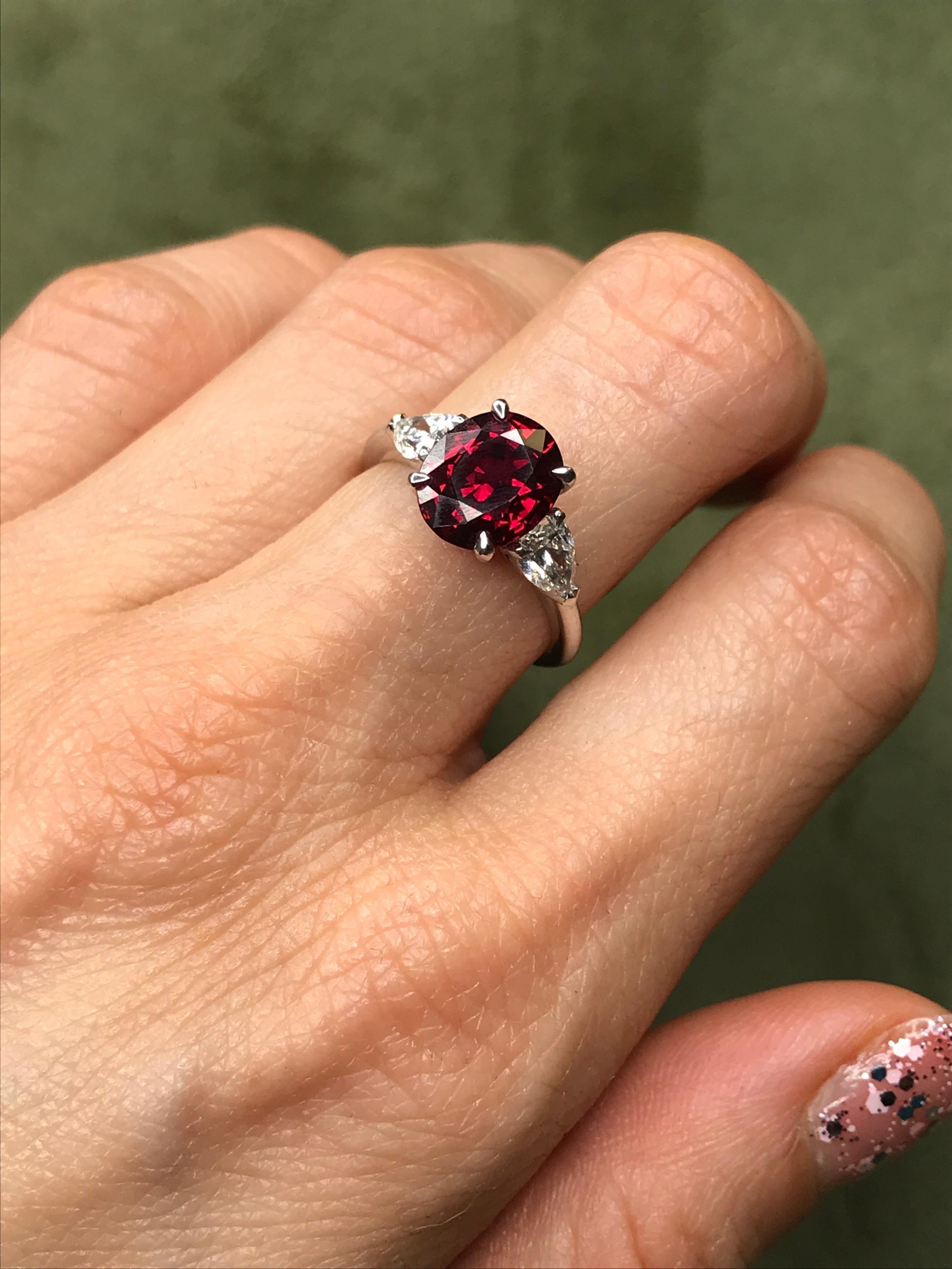 Simple yet striking, this understated piece makes an impact thanks to a spectacular central oval ruby, chosen from the Haruni vault for its intense red tone. Enhancing the rich colour of this centre stone are two white diamonds, each cut in an