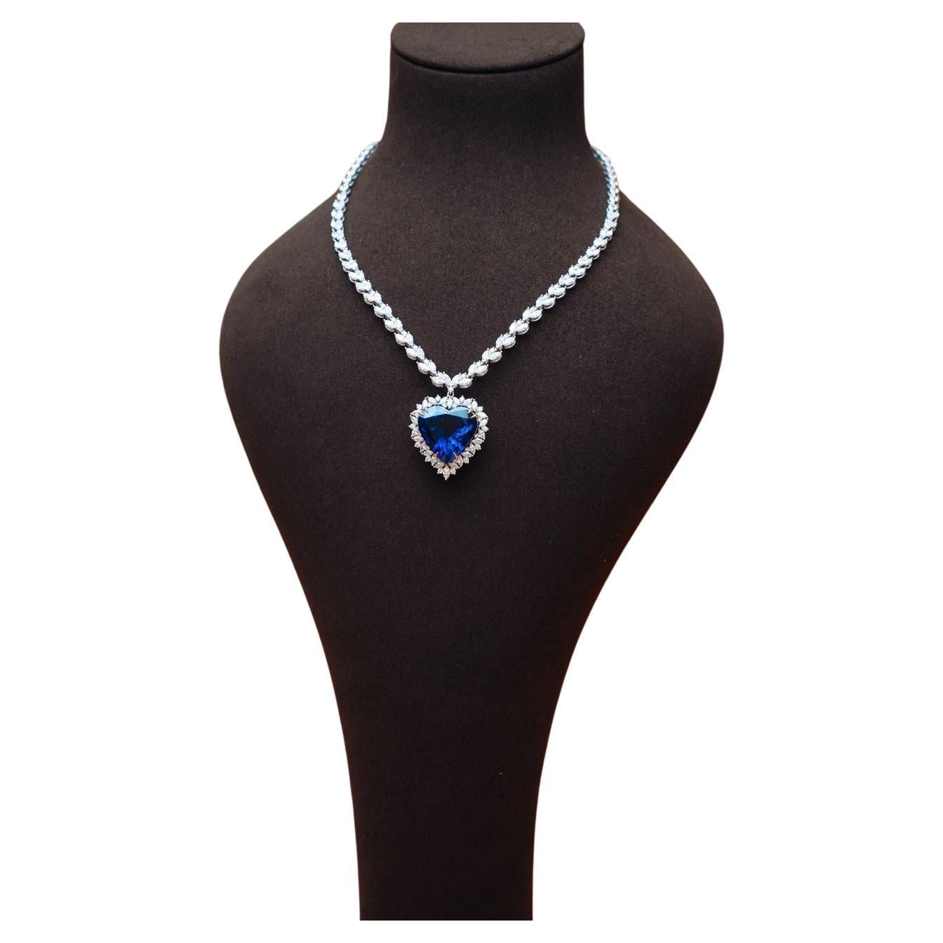 Tanzanite necklace, a remarkable piece expertly crafted by the renowned jeweler Frantisek Holub. This unique necklace showcases a stunning top-quality tanzanite weighing an impressive 30.96 carats, paired with an impeccable GRS certificate, ensuring