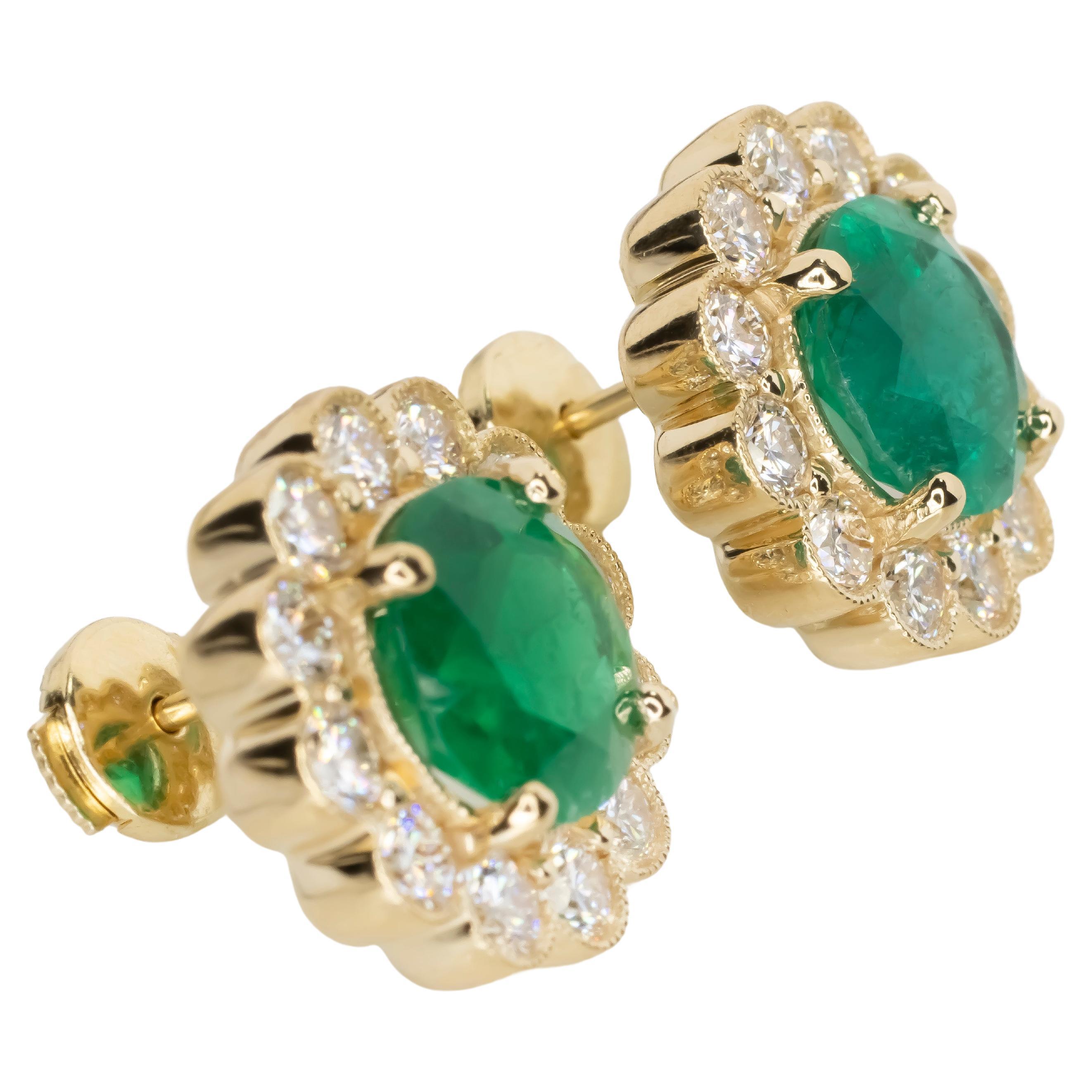 Experience the pinnacle of elegance with these 18K yellow gold scallop earrings, showcasing a captivating pair of GRS-certified Colombian emeralds. Weighing a total of 4.40 carats, these natural emeralds (2.16 ct and 2.24 ct) are brilliantly
