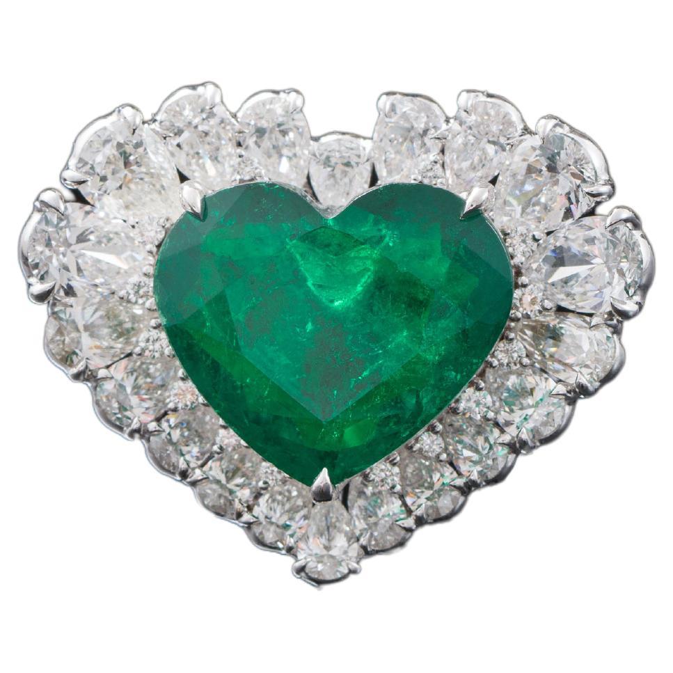 Origin of Colombia Emerald heart, rare shape in the market supply weighing of 7.06ct which is brilliant step cut, Vivid Green with Muzo type, minor quality,Diamond weight total :3.54ct
GRS Certified as Muzo Green 
Size:12.9x14.86 mm
