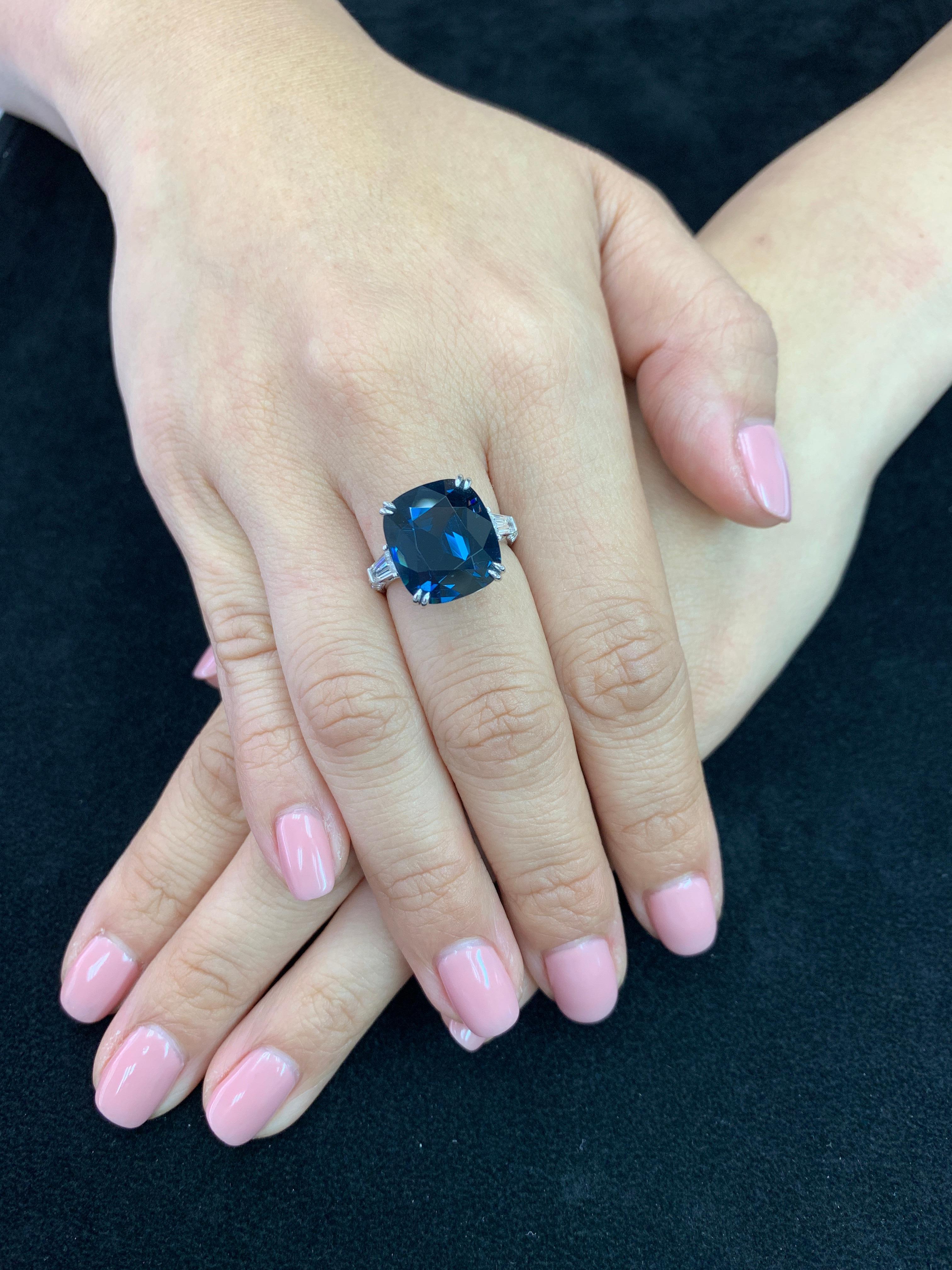 PLEASE CHECK OUT THE HD VIDEO!  This is a world class cobalt spinel! Certified by 2 labs to be a natural Cobalt Spinel without treatments. Oversized at 10.10Cts The ring is set in 18k white gold and diamonds. Two tapered Baguettes 0.54Cts and