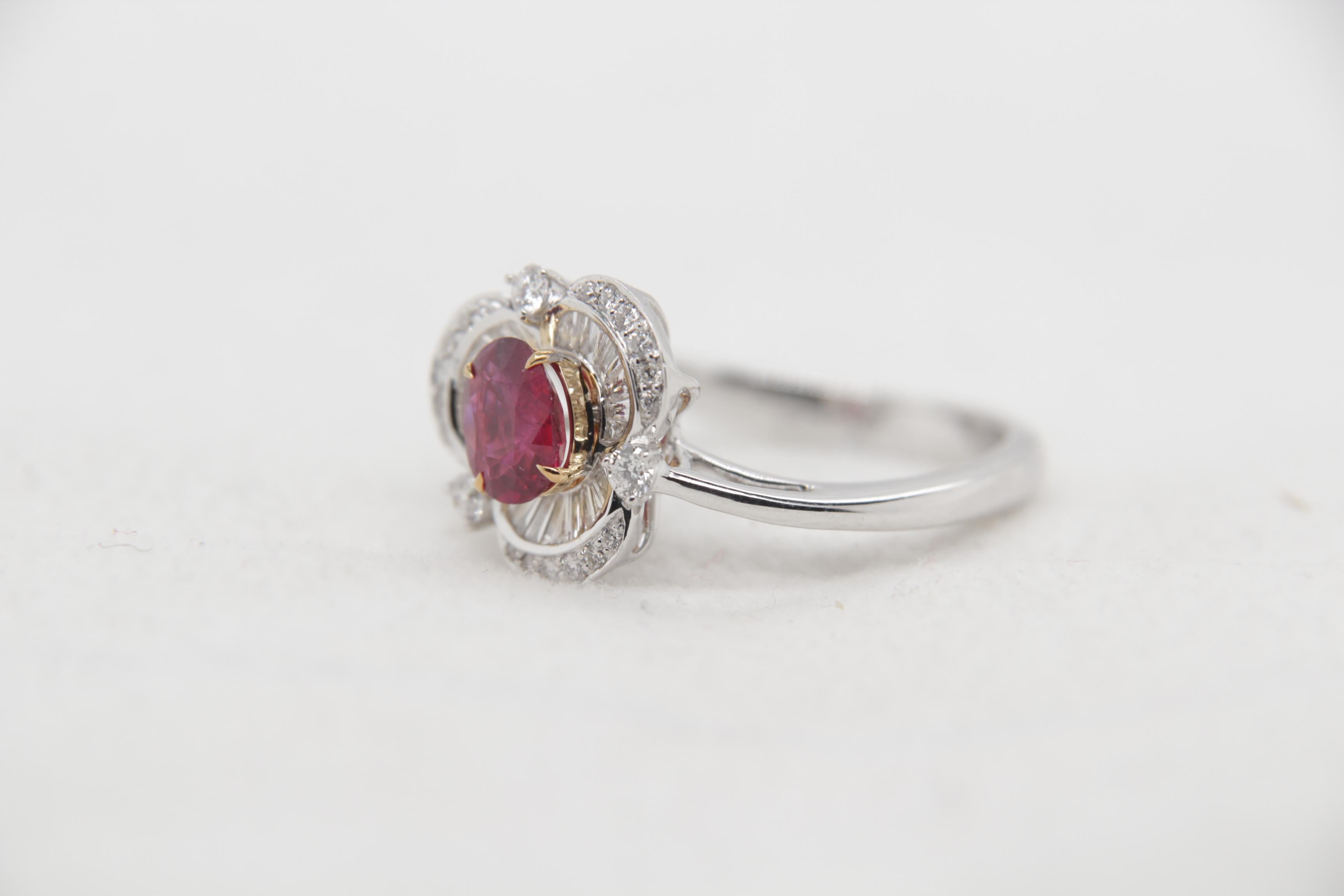 A brand new ruby and diamond ring in 18 Karat Gold. The total ruby weight is 0.76 carats and is certified by Gem Research Swisslab (GRS) as natural, 'no heat' and 'Pigeon's blood'. The total diamond weight is 0.44 carats and total ring weight is