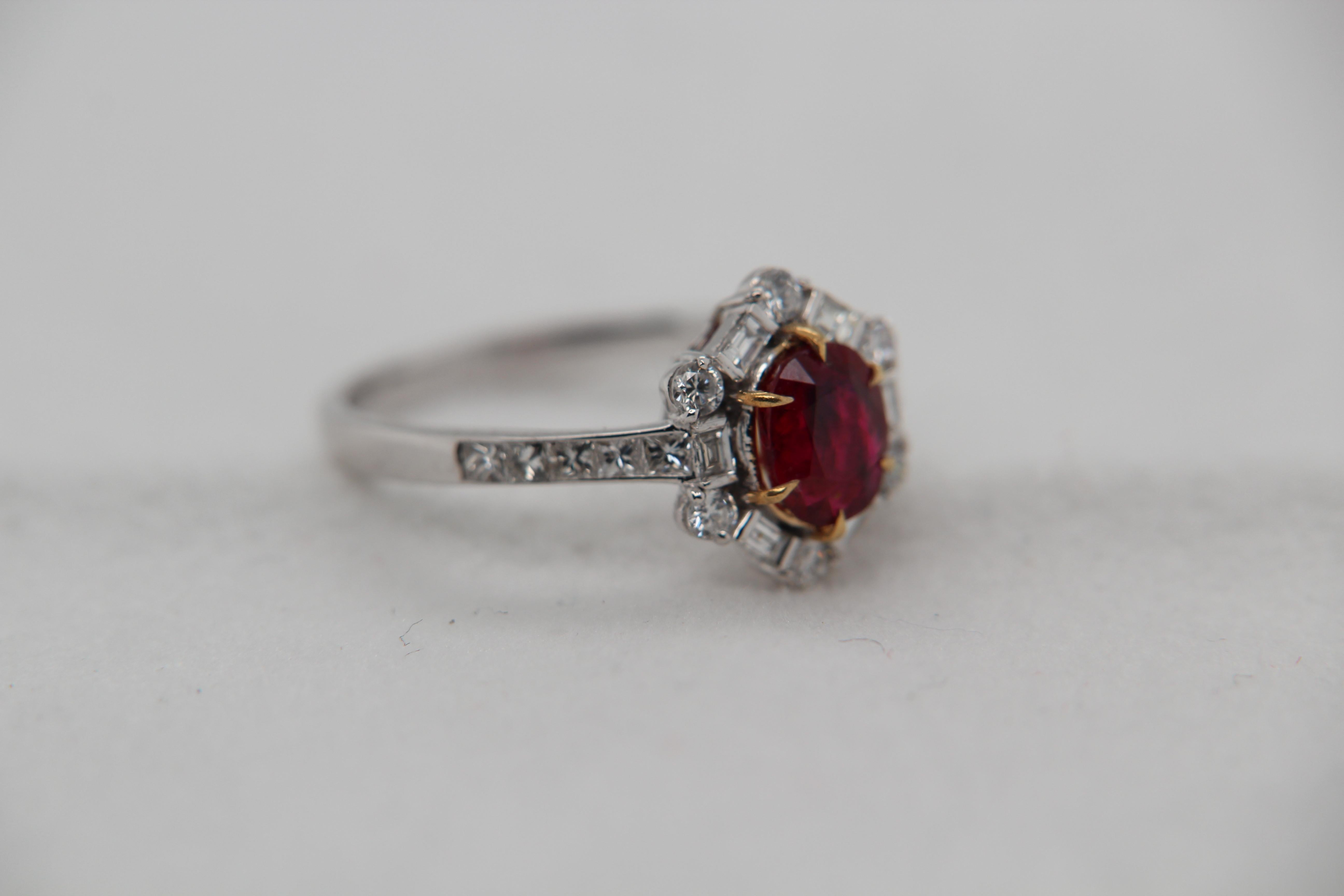 A brand new 1.02 carat Burmese ruby ring mounted with diamonds in 18 Karat gold. The ruby weighs 1.02 carat and is certified by Gem Research Swisslab (GRS) as natural, no heat, and 'Vivid Red Pigeon's Blood'. The total diamond weight is 0.63 carat