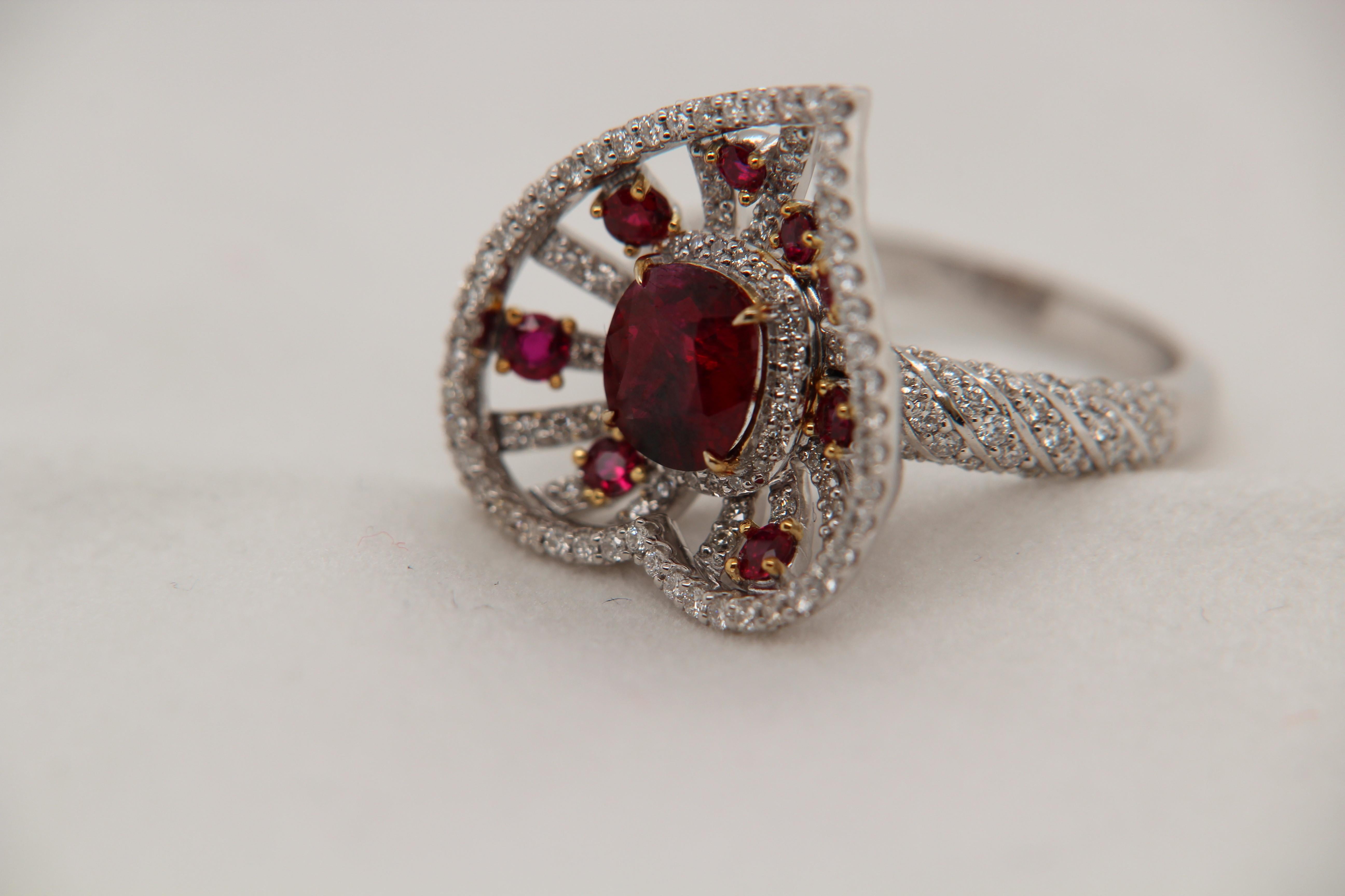 A brand new 1.70 carat Burmese ruby ring mounted with diamonds in 18 Karat gold. The center ruby weighs 1.70 carat and is certified by Gem Research Swisslab (GRS) as natural, no heat and Vivid Red Pigeon's Blood. The total ruby weighs 2.10 carat and
