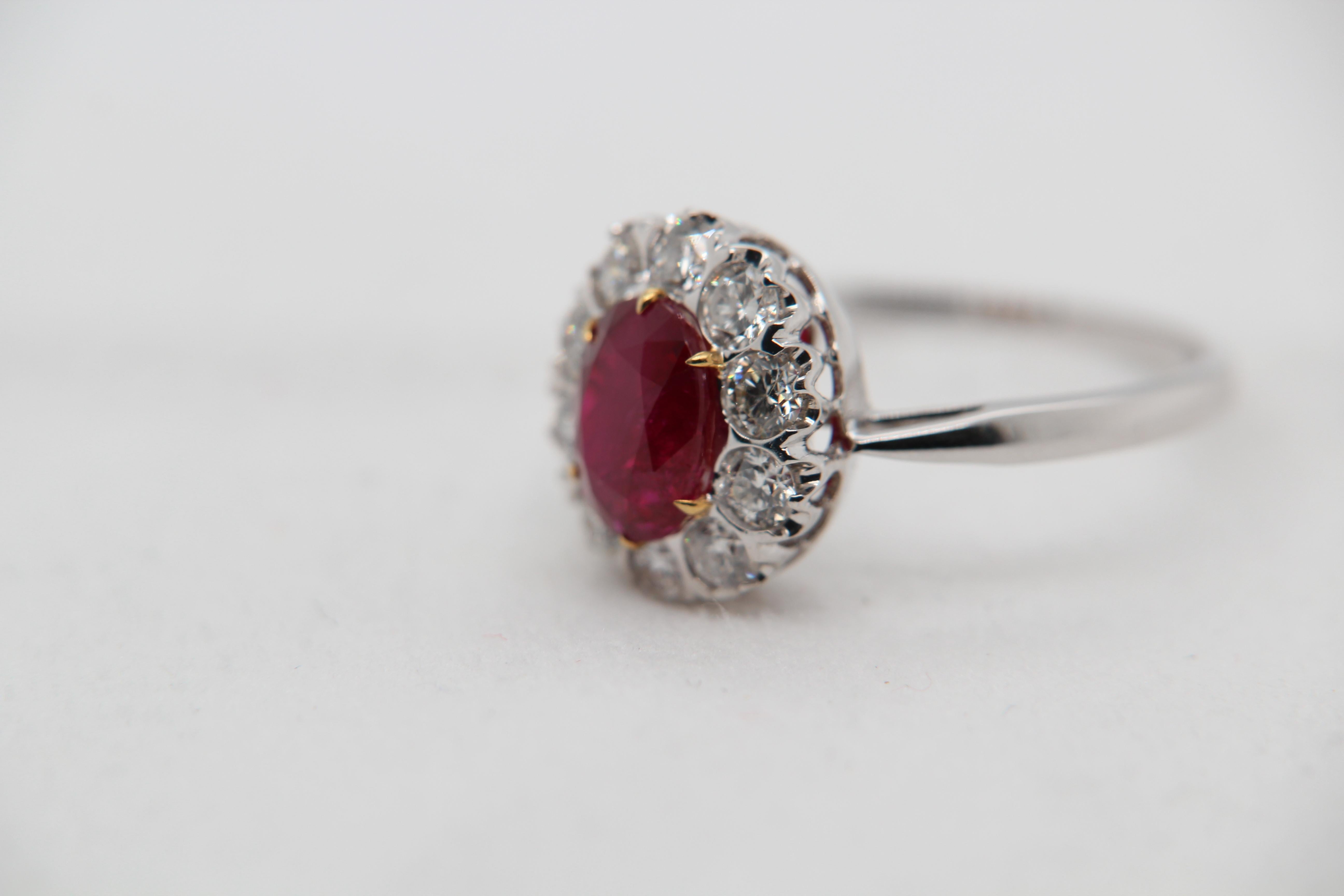 A brand new 2.32 carat Burmese ruby ring mounted with diamonds in 18 Karat gold. The ruby weighs 2.32 carat and is certified by Gem Research Swisslab (GRS) as natural, no heat, and 'Vivid Red Pigeon's Blood'. The total diamond weight is 1.01 carat