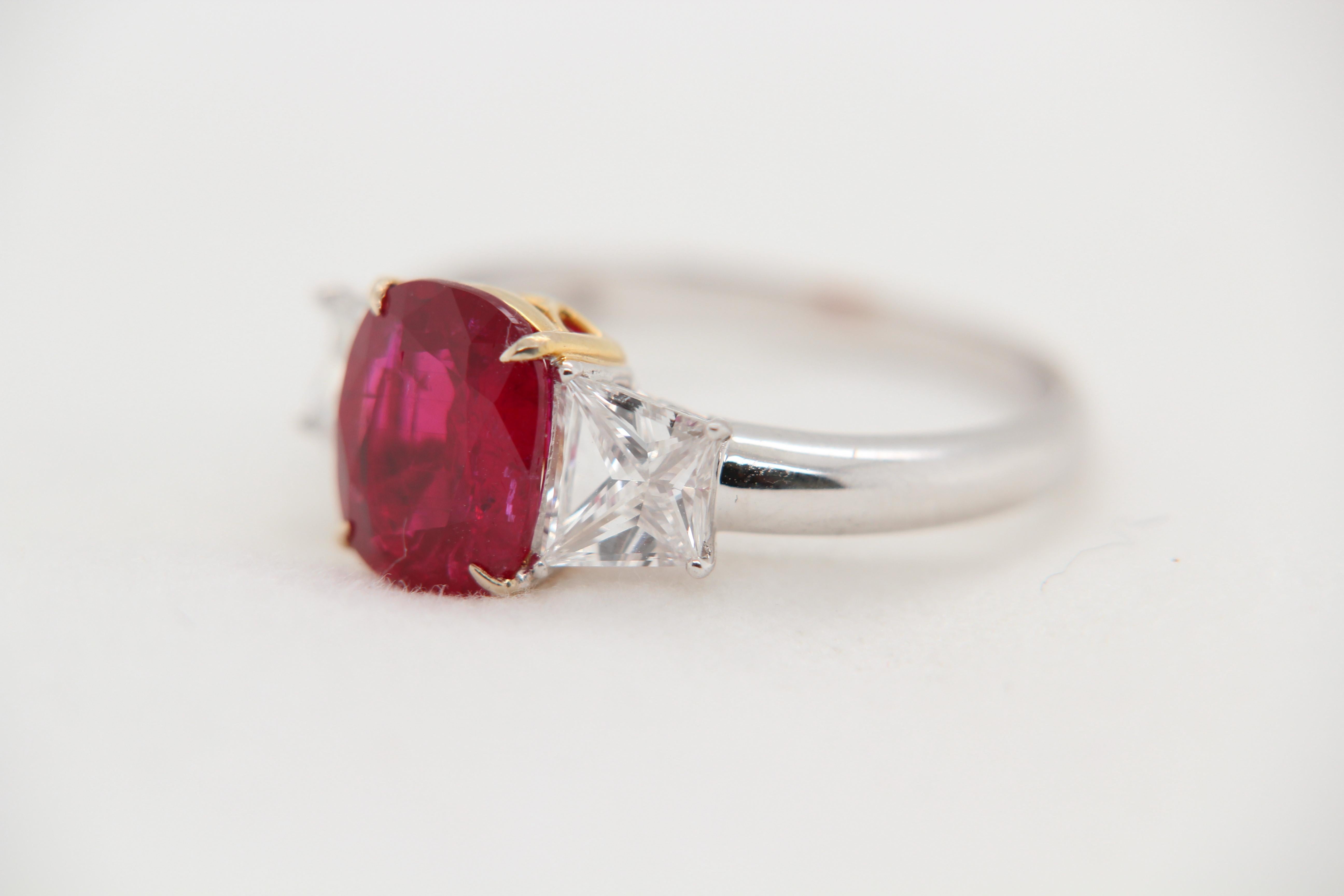 A new 2.44 carat Burmese ruby ring mounted with diamonds in 18 Karat gold. The ruby weighs 2.44 carat and is certified by Gem Research Swisslab (GRS) as natural, no heat, and 'Vivid Red Pigeon's Blood'. The ruby is from the 'Mogok' mine in Burma.