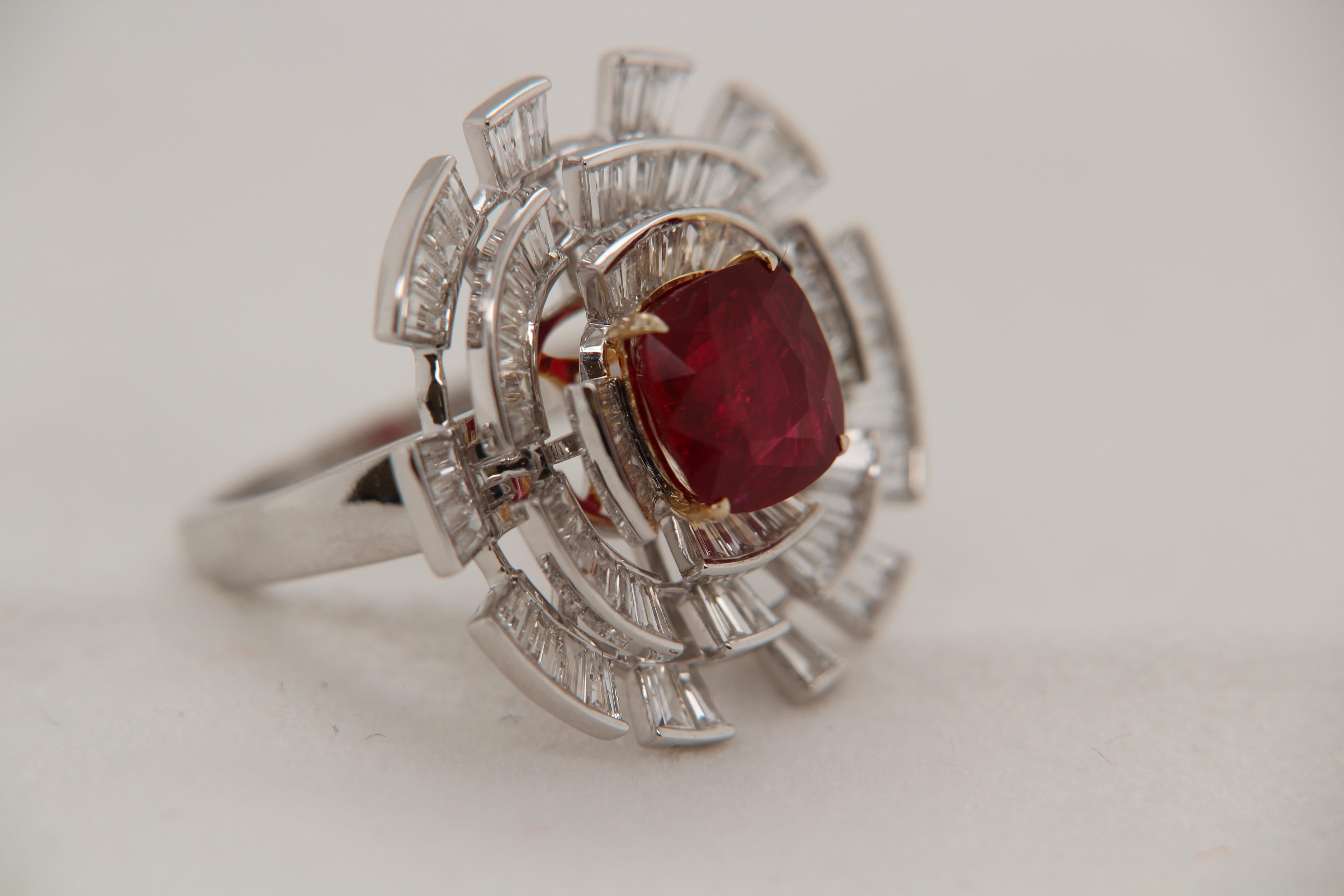 A brand new 2.65 carat Burmese ruby ring mounted with diamonds in 18 Karat gold. The ruby weighs 2.65 carat and is certified by Gem Research Swisslab (GRS) as natural, no heat, and 'Vivid Red Pigeon's Blood'. The total diamond weight is 1.98 carat