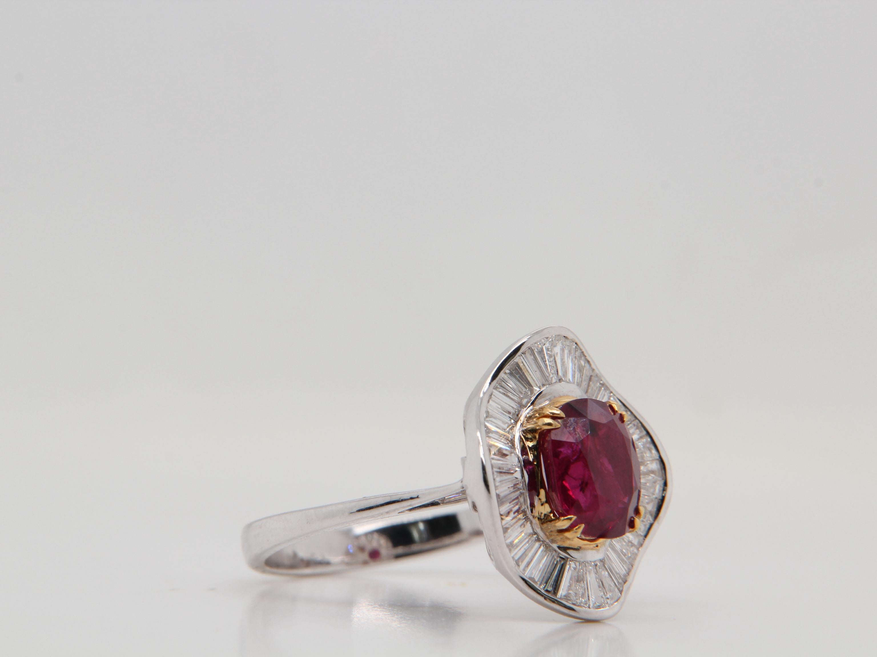 A brand new 3.04 carat Burmese ruby ring mounted with diamonds in 18 Karat gold. The ruby weighs 3.04 carat and is certified by Gem Research Swisslab (GRS) as natural, no heat, and red The total diamond weight is 0.83 carat and the total rings
