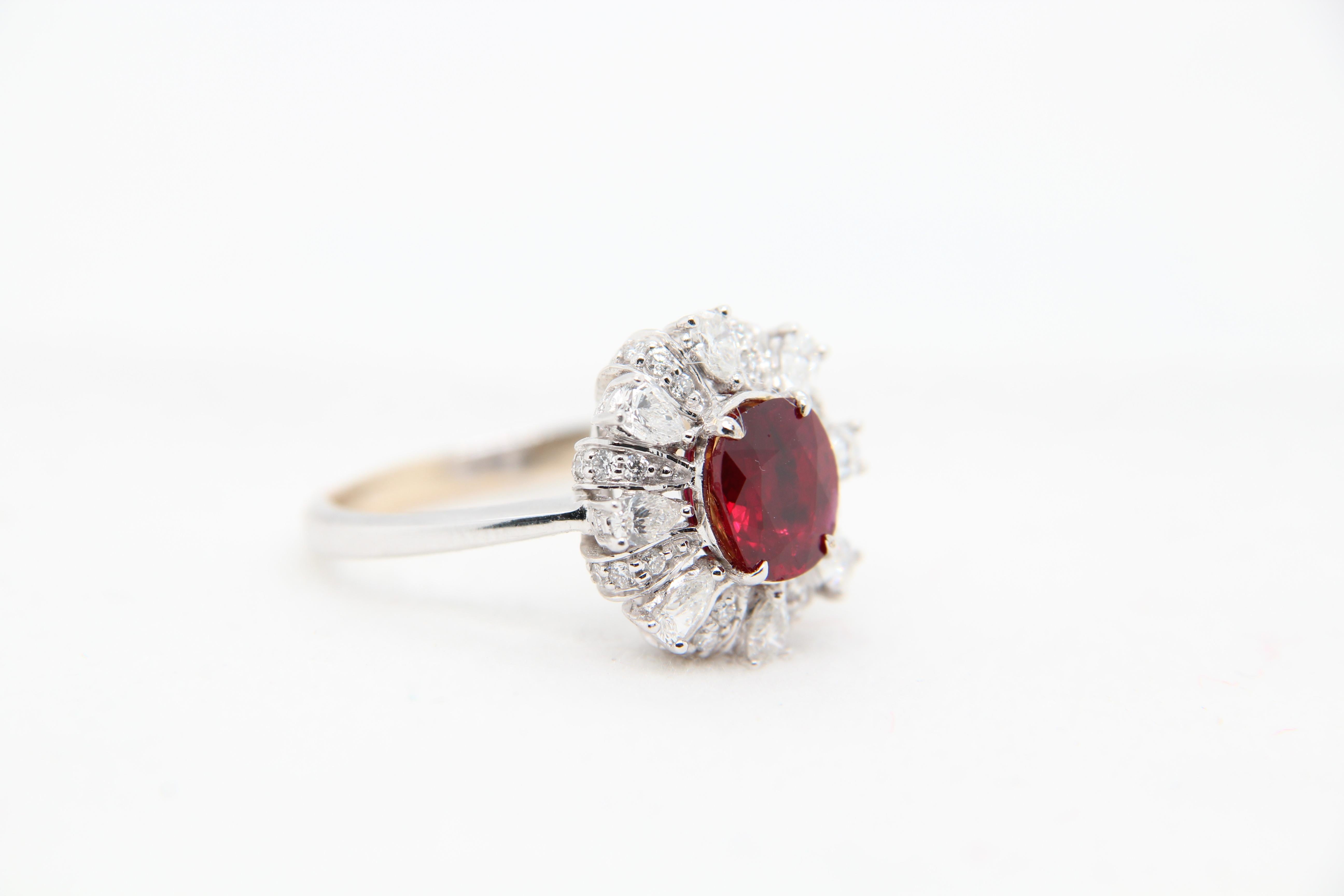 Ring made from Burmese unheated ruby and diamond. The ruby is of weight 1.48 carat and is certified by Gem Research Swisslab (GRS) unheated and 'Pigeon's Blood'. The ring is made in 18 karat gold. The total diamond weight is 0.86 carat.