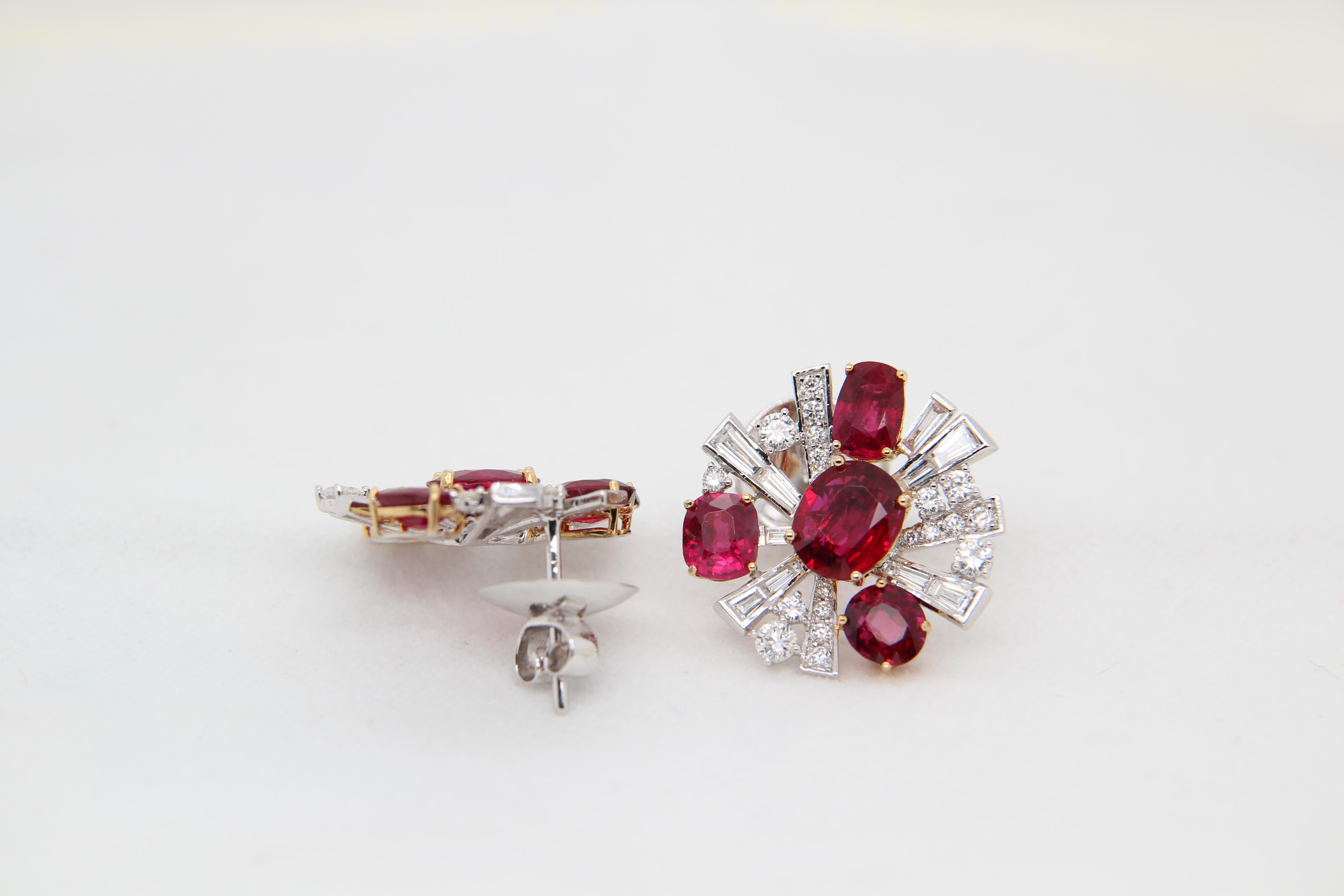 Earrings made from Burmese unheated rubies and diamond earrings. The centre two rubies are of weight 1.05 and 1.18 carat and are both certified by Gem Research Swisslab (GRS) unheated and 'Pigeon's Blood'. The two centre stones as well as the
