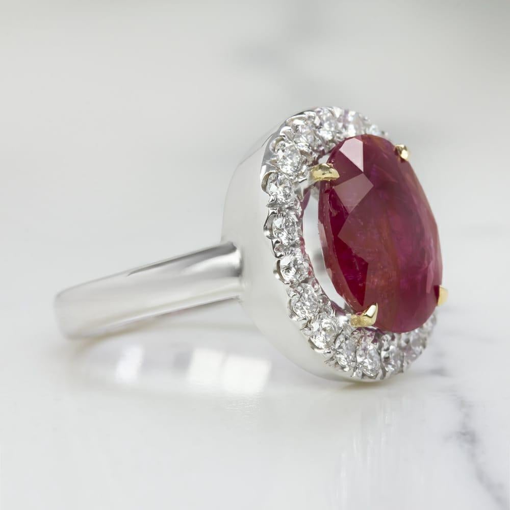Modern GRS Switzerland 4.50 Carat Certified Oval Ruby with Diamond Halo Ring