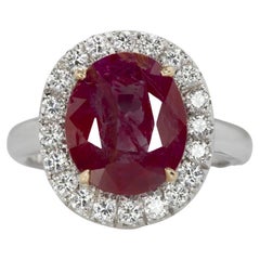 GRS Switzerland 4.50 Carat Certified Oval Ruby with Diamond Halo Ring