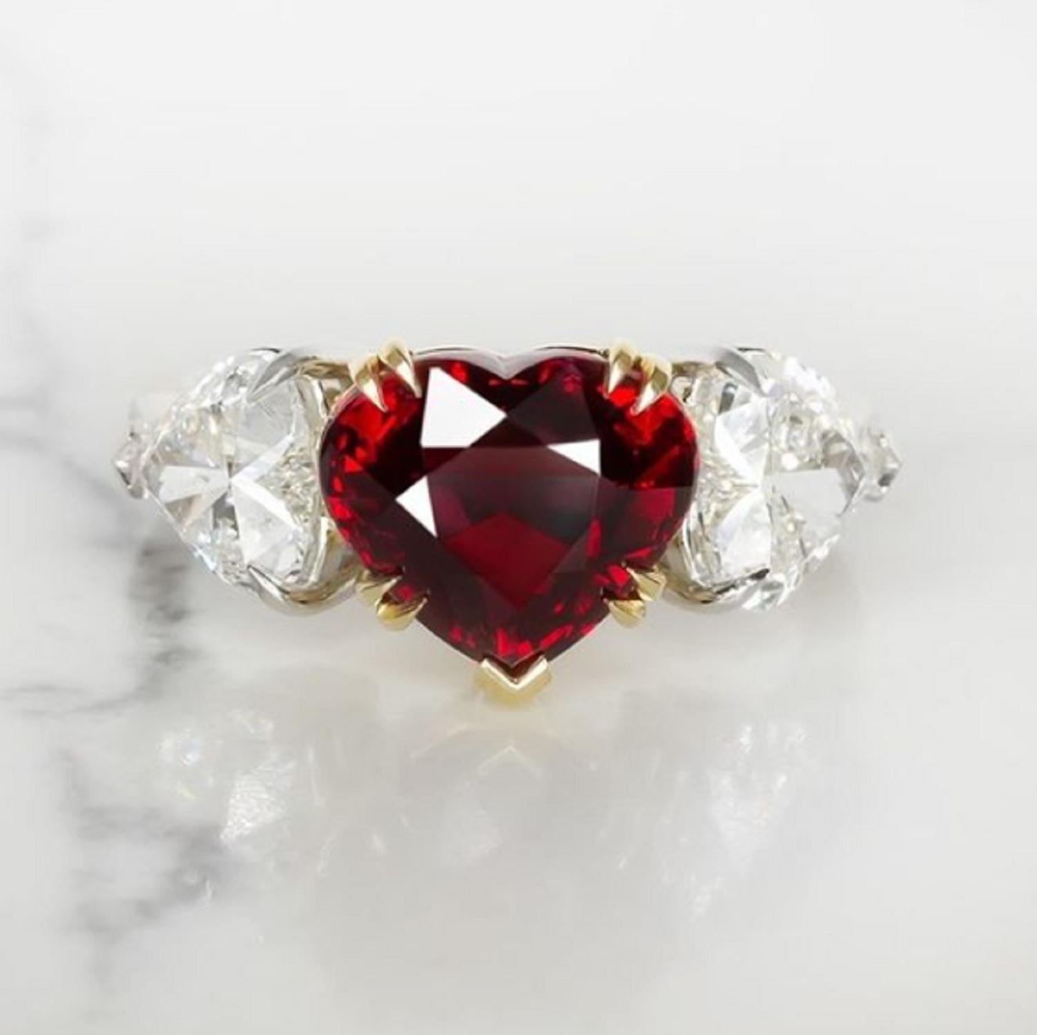 Magnificent, very large, 4.02 carat heart shaped pigeon's blood red faceted ruby solitaire ring is set in solid platinum and accompanied by  super sparkly GIA certified heart shape white diamonds of approximately 1.80 carats in total.

This ruby not