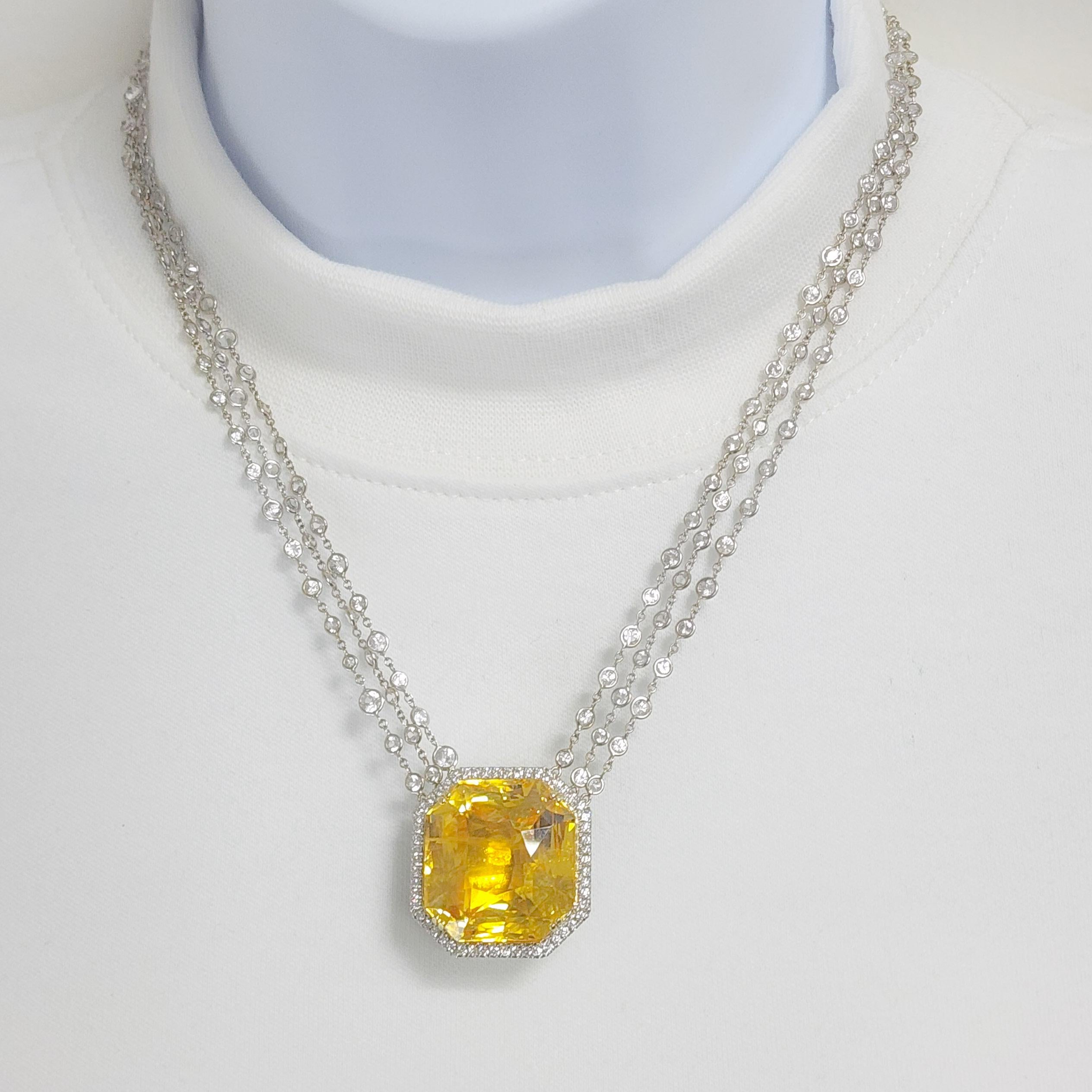 Absolutely spell bounding 80.26 ct. unheated Sri Lanka yellow sapphire octagon with 20.00 ct. good quality white diamond rounds around the stone and white sapphire rounds on the chains.  Handmade in platinum and 18k yellow gold.  This necklace is