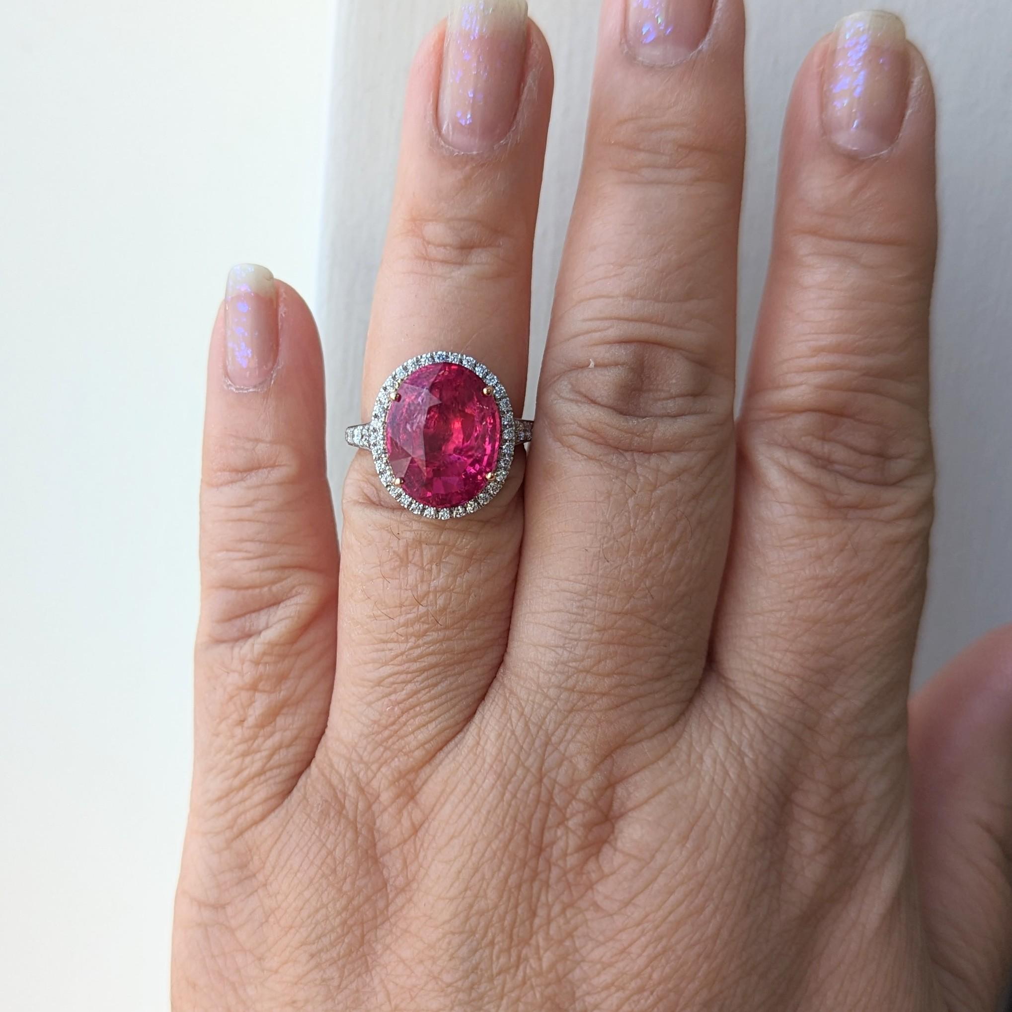 Absolutely gorgeous 10.04 ct. unheated Tanzanian pinkish red spinel oval with good quality white diamond rounds.  Handmade in platinum and 18k rose gold.  Ring size 6.75.  GRS certificate included.