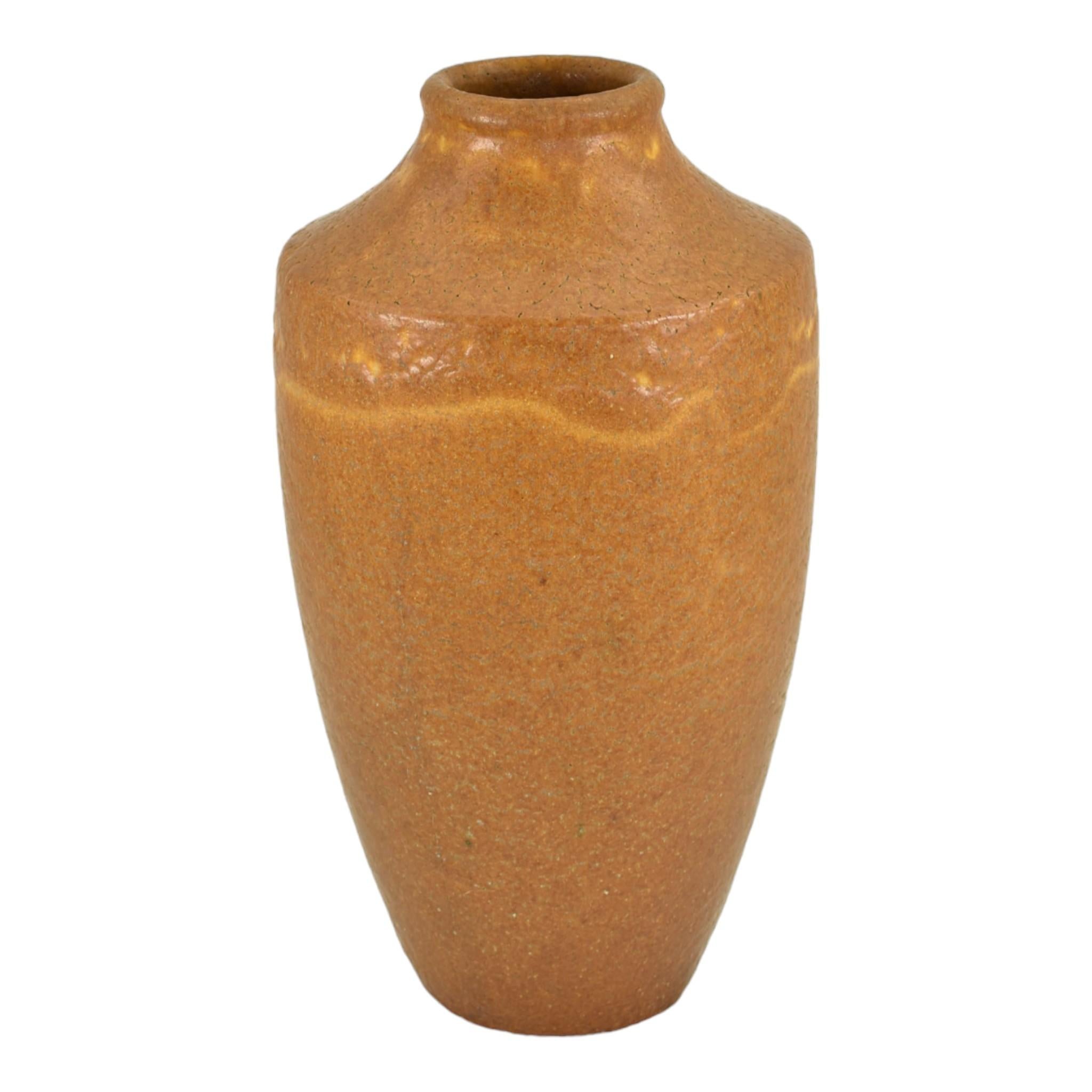 Grueby 1900s Vintage Arts and Crafts Pottery Organic Matte Brown Vase
Early and large arts and crafts Grueby vase covered in a wonderful organic matte caramel brown glaze. 
Excellent condition. There is an almost non-detectable mid body hairline