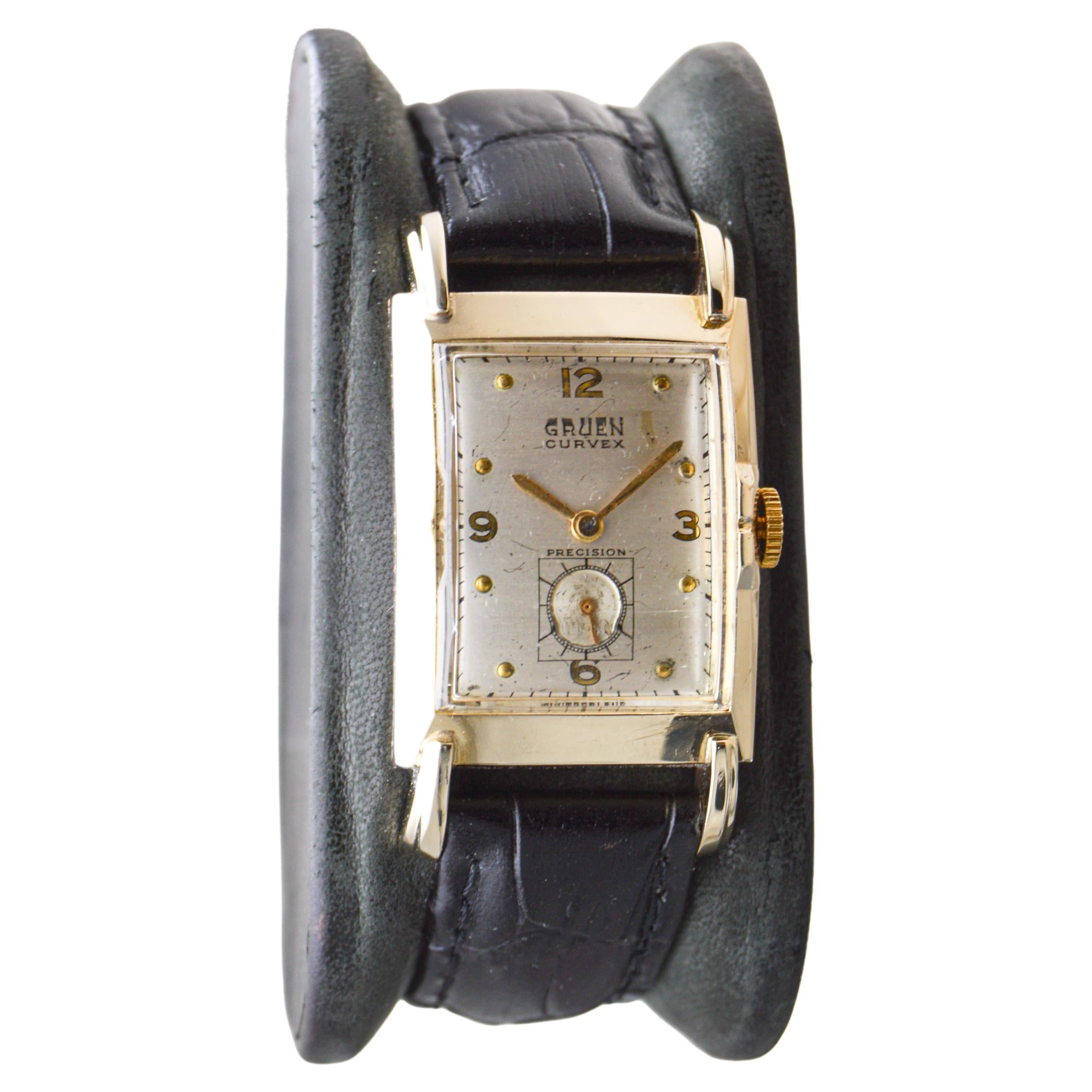 FACTORY / HOUSE: Gruen Watch Company
STYLE / REFERENCE: Art Deco / Tank Style / Reference 770
METAL / MATERIAL: Yellow Gold Filled
CIRCA / YEAR: 1940's
DIMENSIONS / SIZE: Length 41mm X Width 23mm
MOVEMENT / CALIBER: Manual Winding / 17 Jewels /