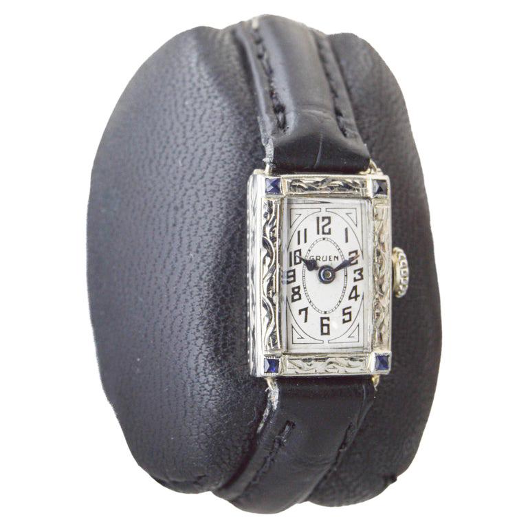 FACTORY / HOUSE: Gruen Watch Company
STYLE / REFERENCE: Art Deco / Tank Style
METAL / MATERIAL: 14Kt. Solid White Gold / Genuine Sapphires
CIRCA / YEAR: 1920's
DIMENSIONS / SIZE: Length 24mm X Width 14mm
MOVEMENT / CALIBER: Manual Winding / 15