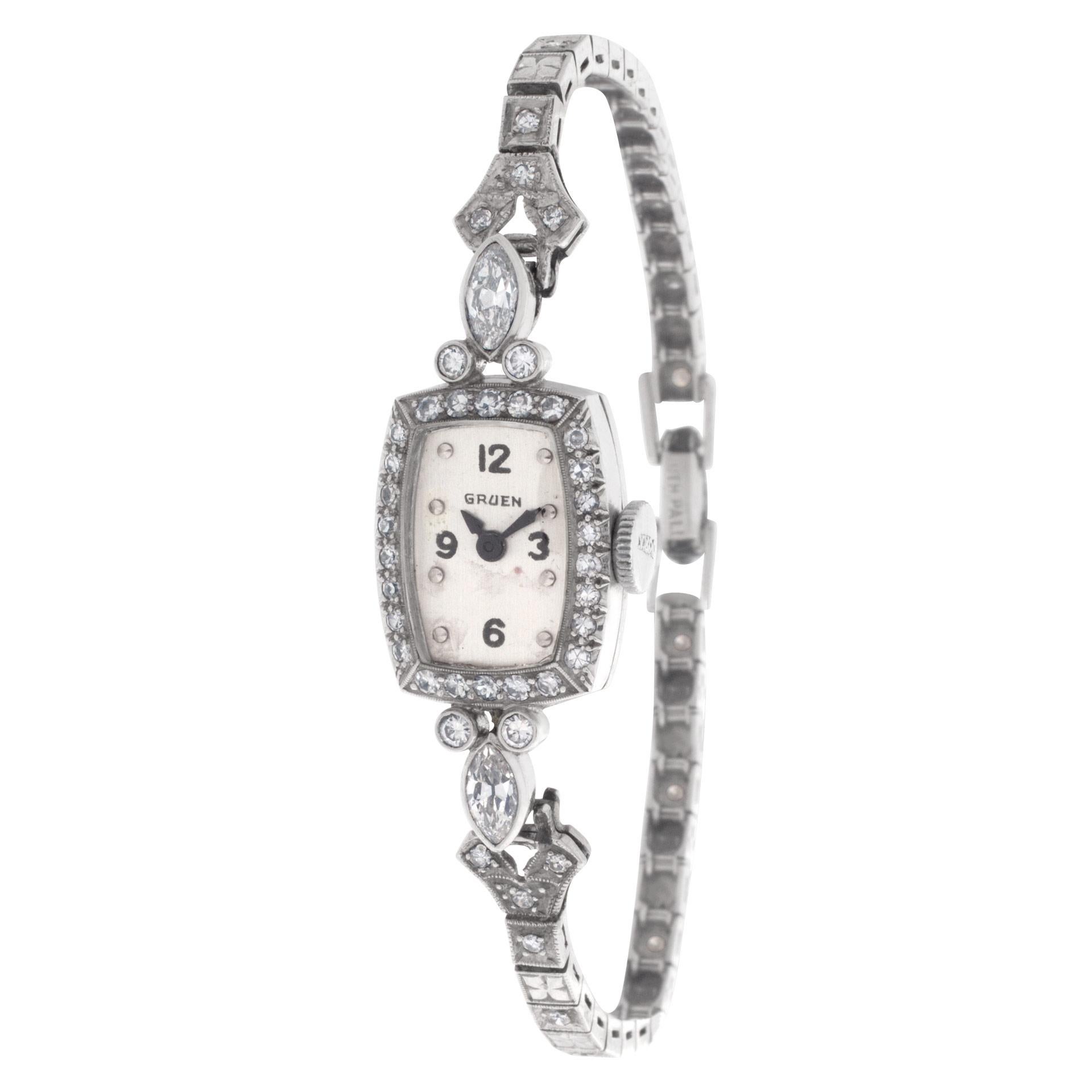 Gruen Classic in platinum with 2 carats of diamonds (marquee and round) in the bezel and  bracelet. Manual wind movement. Fits 6 inches wrist. 13.8 mm case size. Circa 1935 Fine Pre-owned Gruen Watch.   Certified preowned Vintage Gruen Classic watch